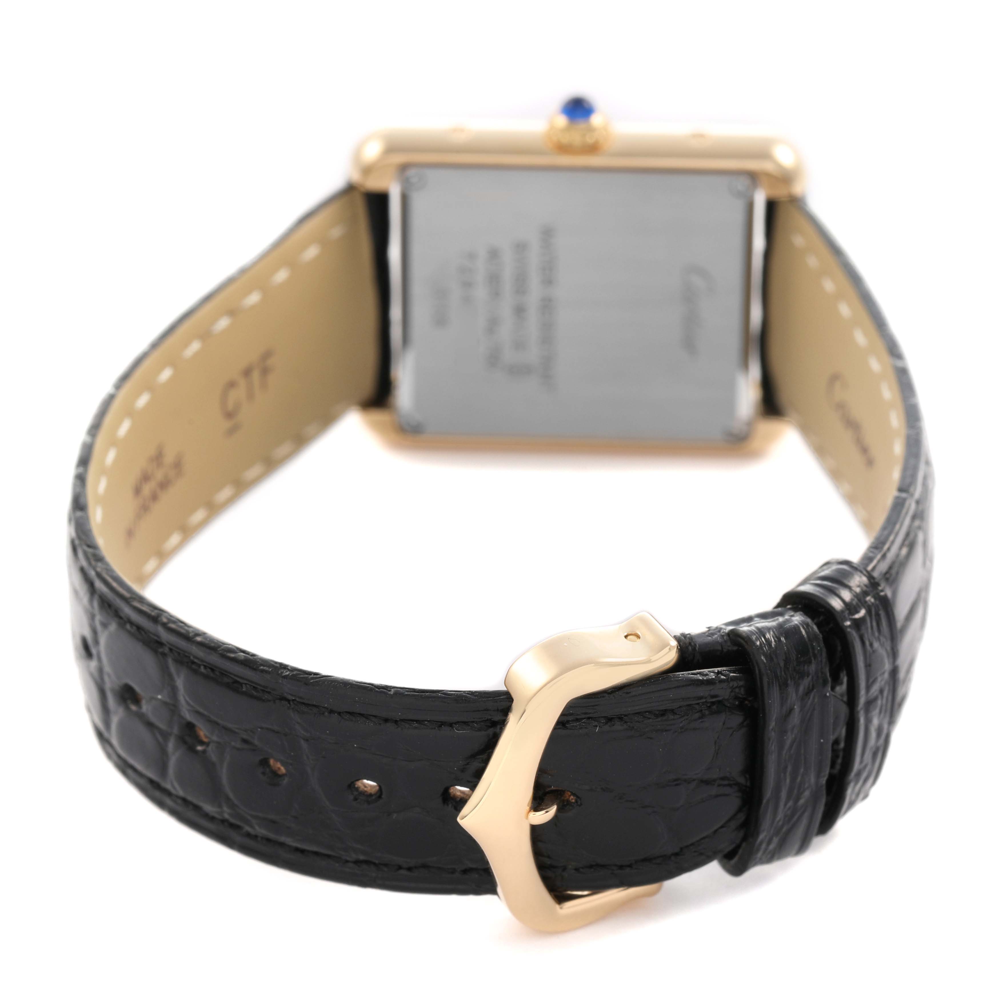 The image shows the back of the Cartier Tank Solo W5200002 Women's Yellow Gold Silver Dial watch, depicting the buckle and case back details.