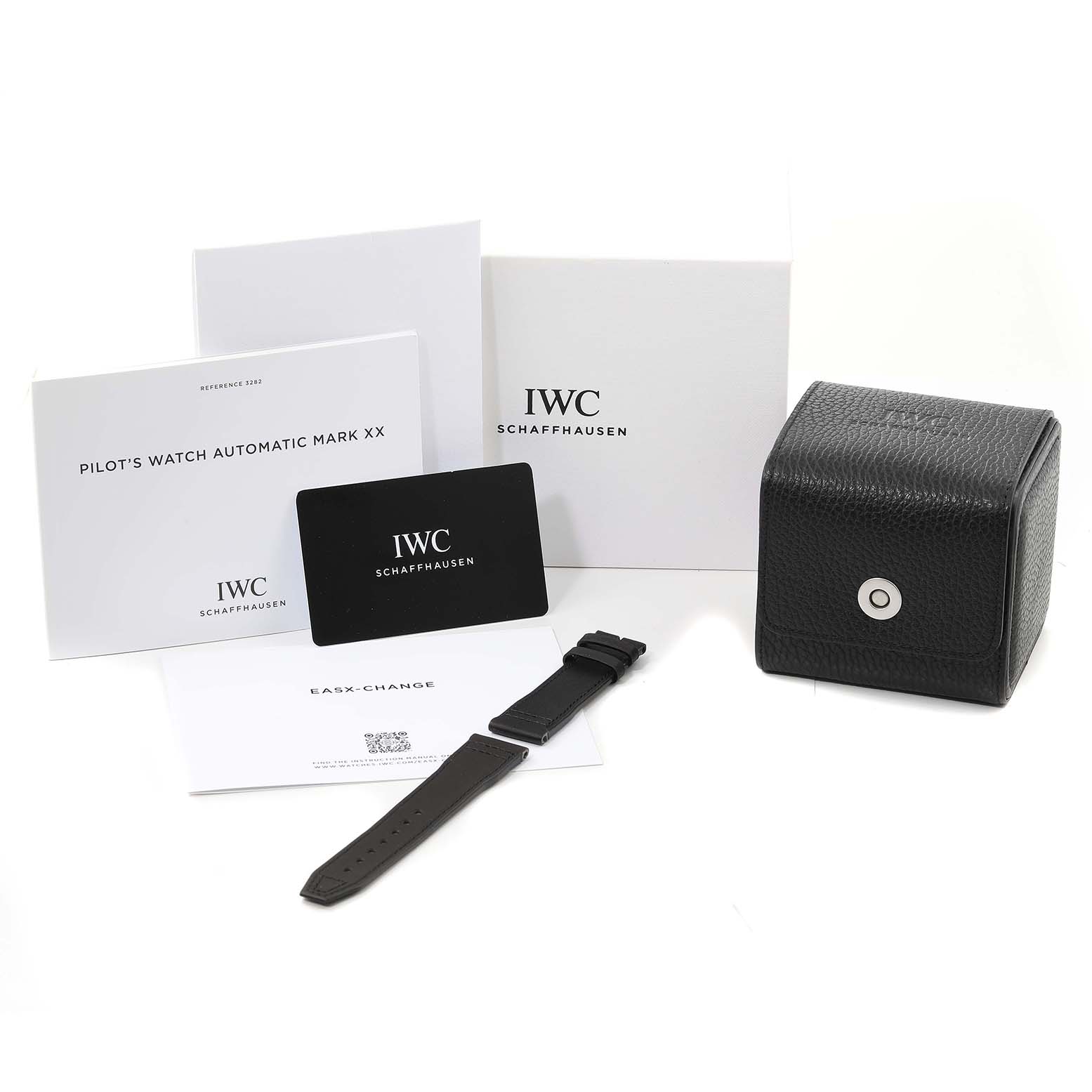 The image shows the box, manuals, an extra strap, and a care card for the IWC Pilot IW328201 Men
s Stainless Steel Black Dial IW328201 Men
s Stainless Steel Black Dial
s Watch Automatic Mark XX.