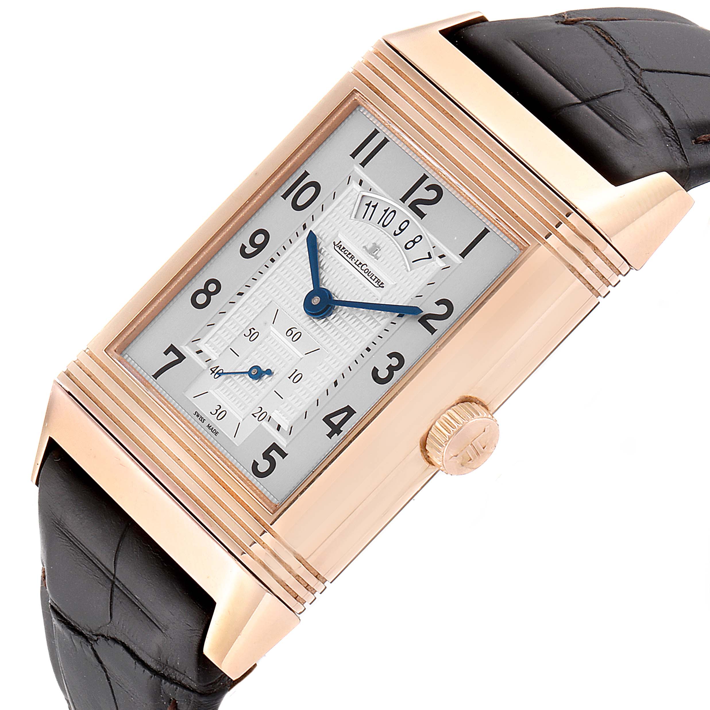 The image shows a Jaeger LeCoultre Reverso Q3742521 Men's Rose Gold Silver Dial Q3742521 Men's Rose Gold Silver Dial watch at an angle highlighting the dial, crown, and part of the black strap.