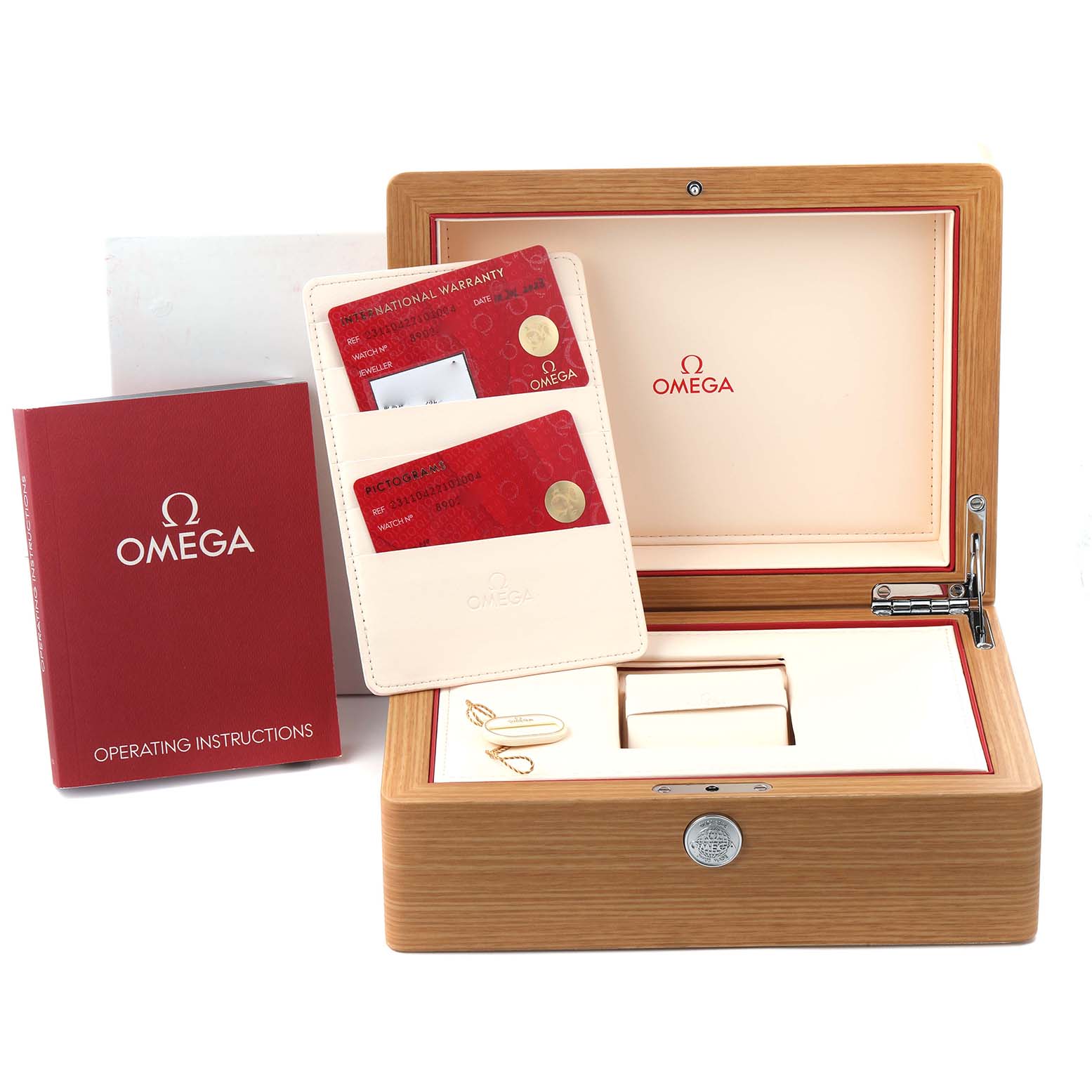 The image shows a straight-on view of the Aqua Terra Omega watch box, with warranty cards and operating instructions.
