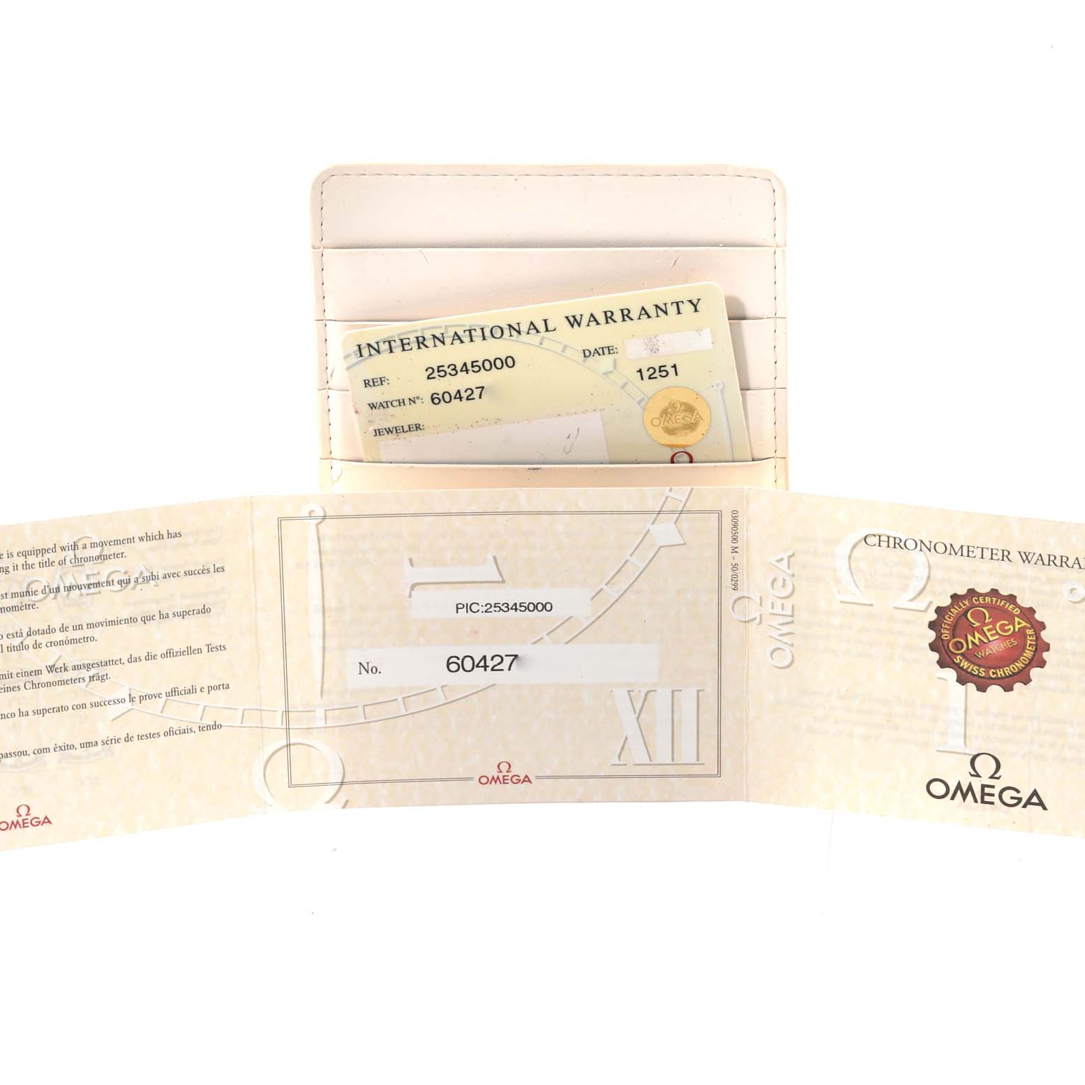 The image shows an international warranty card and booklet for the Omega Seamaster 2534.50.00 Men
s Stainless Steel Black Dial 2534.50.00 Men
s Stainless Steel Black Dial model from an above angle.