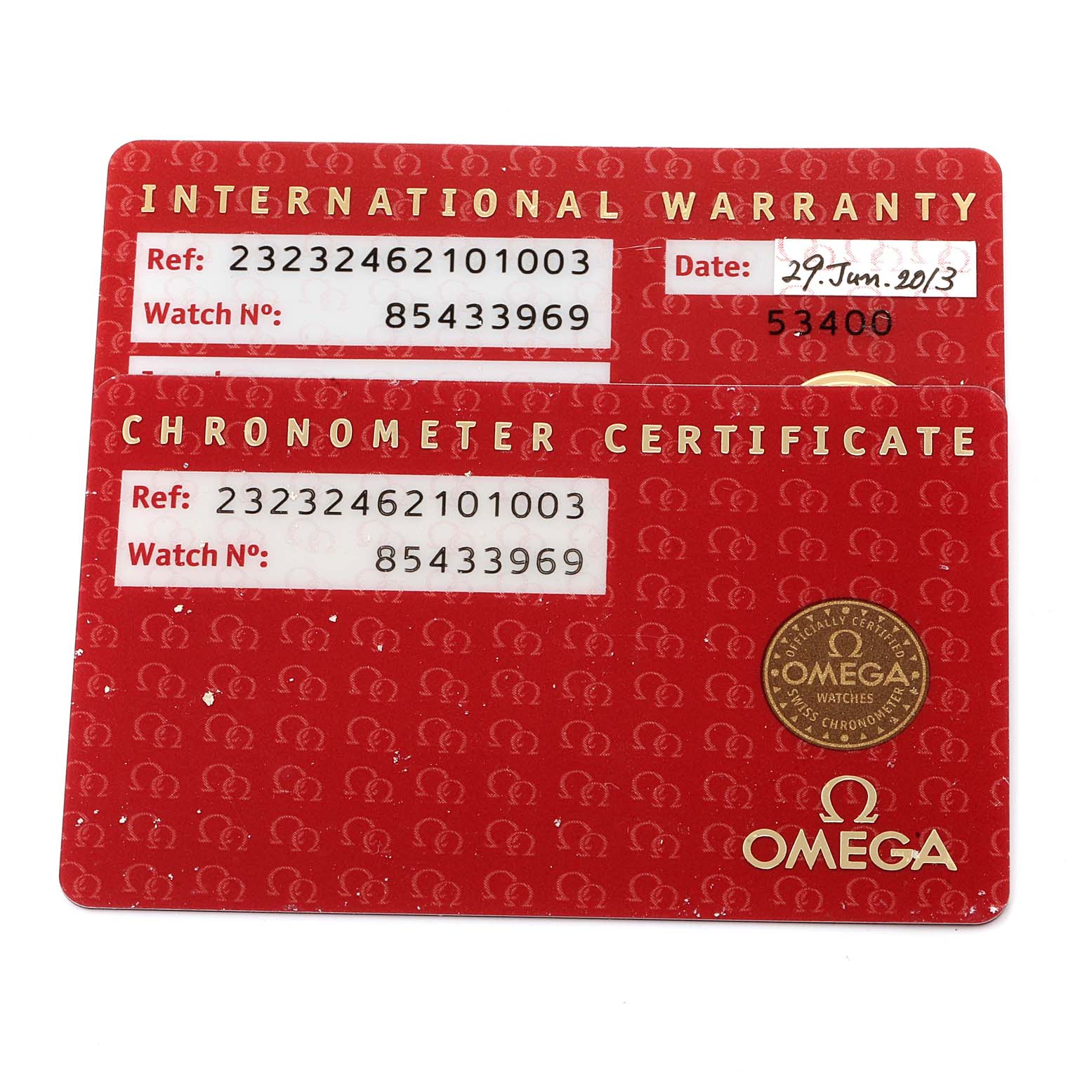 Two red cards showing the international warranty and chronometer certificate for the Omega Planet Ocean 232.32.46.21.01.003 Men
s Stainless Steel Black Dial 232.32.46.21.01.003 Men
s Stainless Steel Black Dial watch.