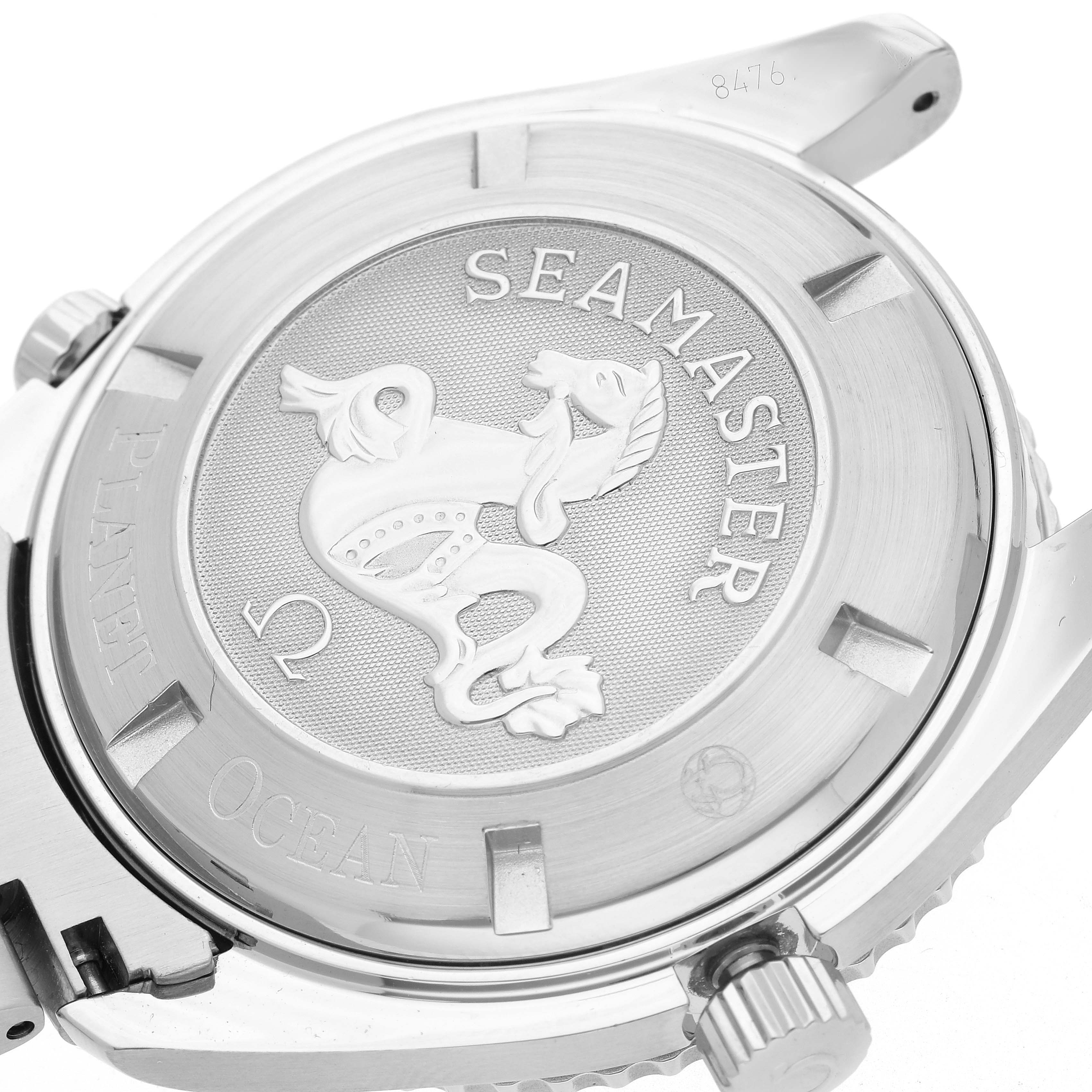 The image shows the case back of the Omega Planet Ocean 2208.50.00 Men's Stainless Steel Black Dial 2208.50.00 Men's Stainless Steel Black Dial watch, highlighting the "Seamaster" engraving and emblem.