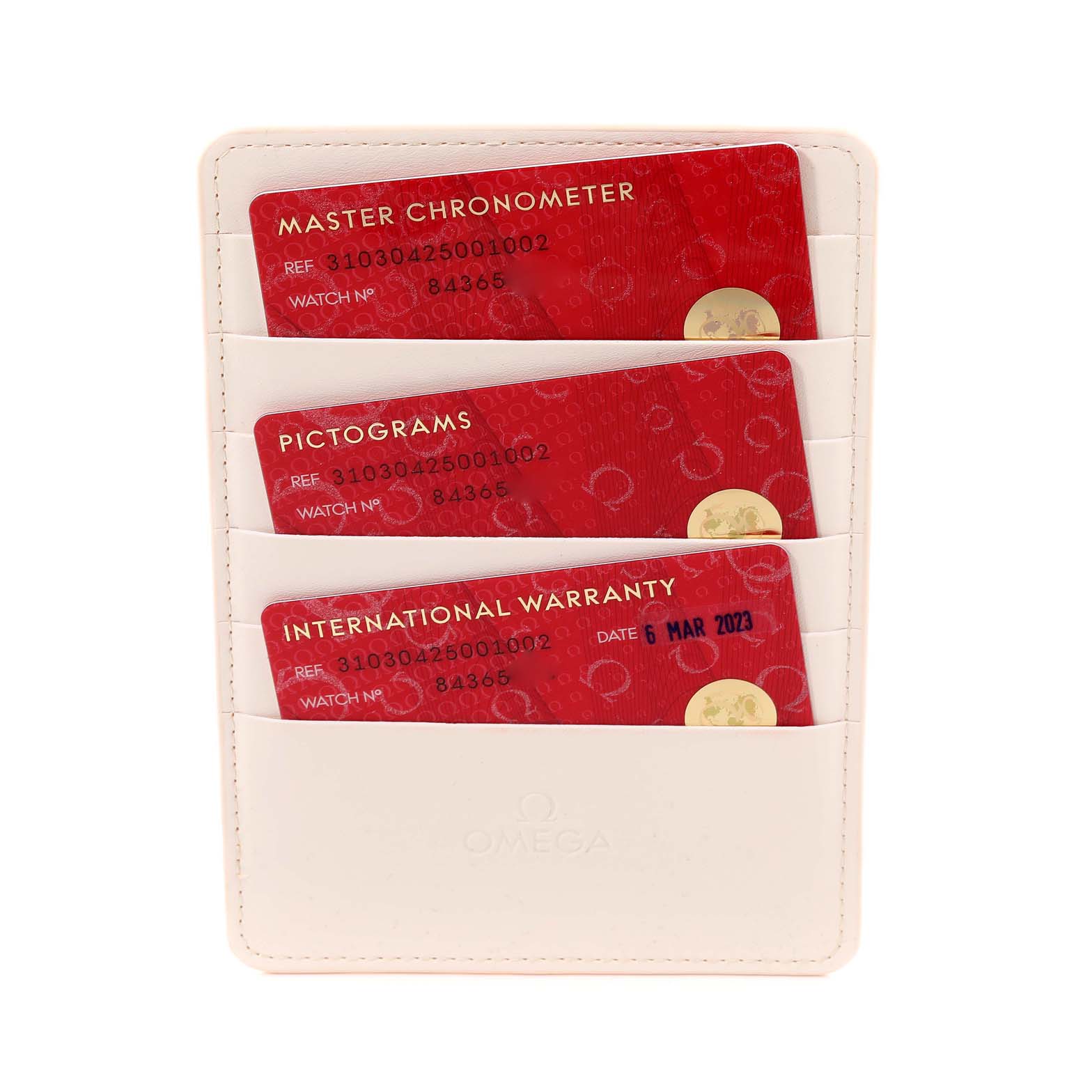 This image shows the warranty and pictogram cards in a holder for the Omega Speedmaster 310.30.42.50.01.002 Men's Stainless Steel Black Dial 310.30.42.50.01.002 Men's Stainless Steel Black Dial watch, viewed from above.