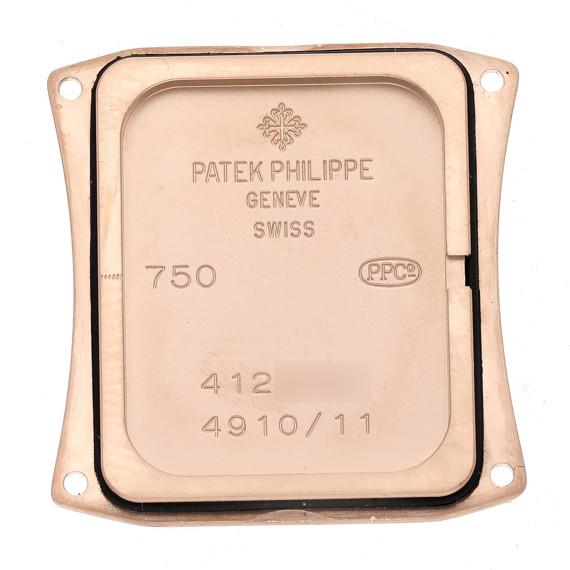 The image shows the case back of a Patek Philippe Twenty-4 4910R Women's Rose Gold Brown Dial 4910R Women's Rose Gold Brown Dial watch, viewed from directly above, displaying inscriptions and markings.