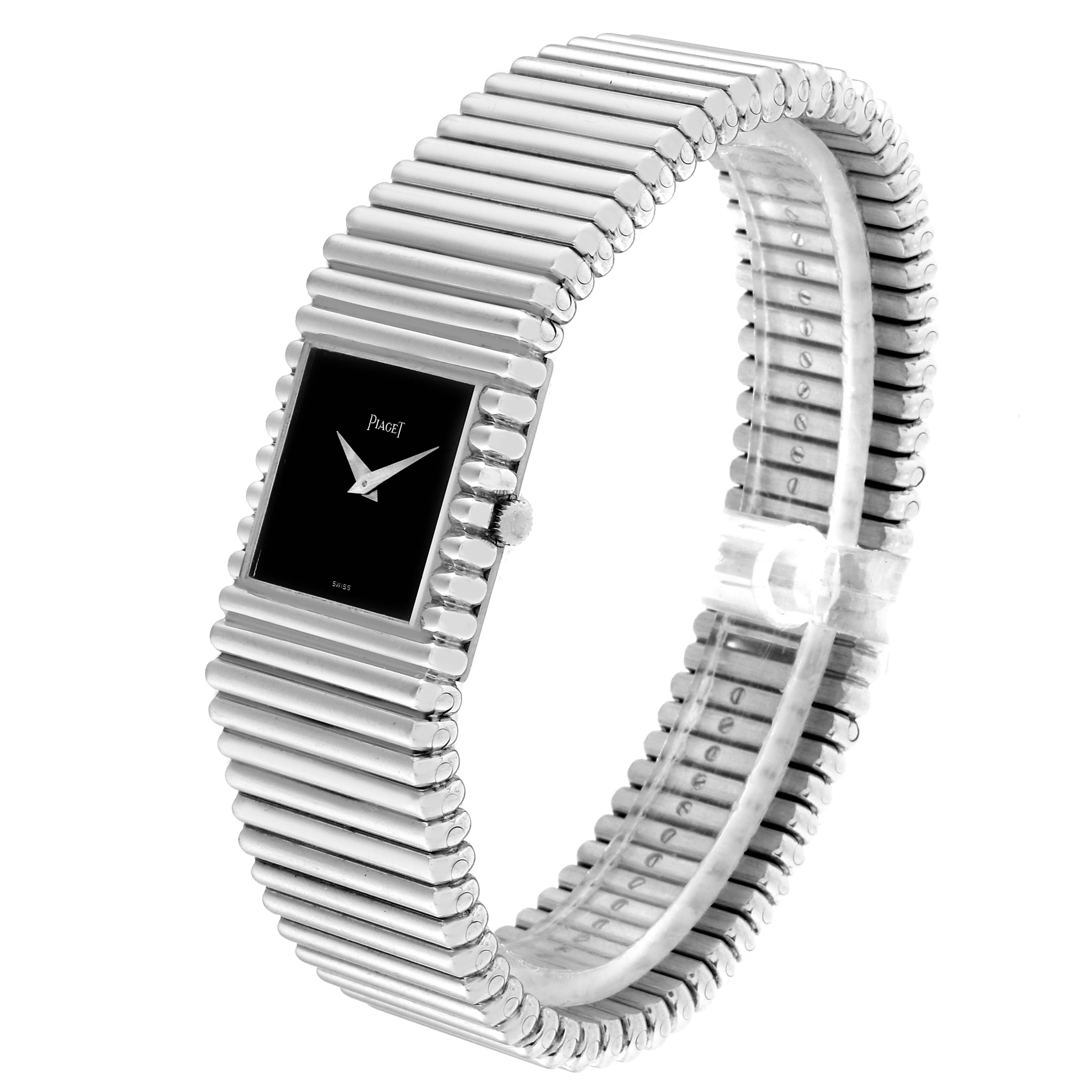 The Piaget 9131 C 10 Men
s White Gold Black Dial 9131 C 10 Men
s White Gold Black Dial Polo 18K White Gold Black Dial Mens Watch 9131 is shown from a side angle, displaying the dial, case, crown, and bracelet.