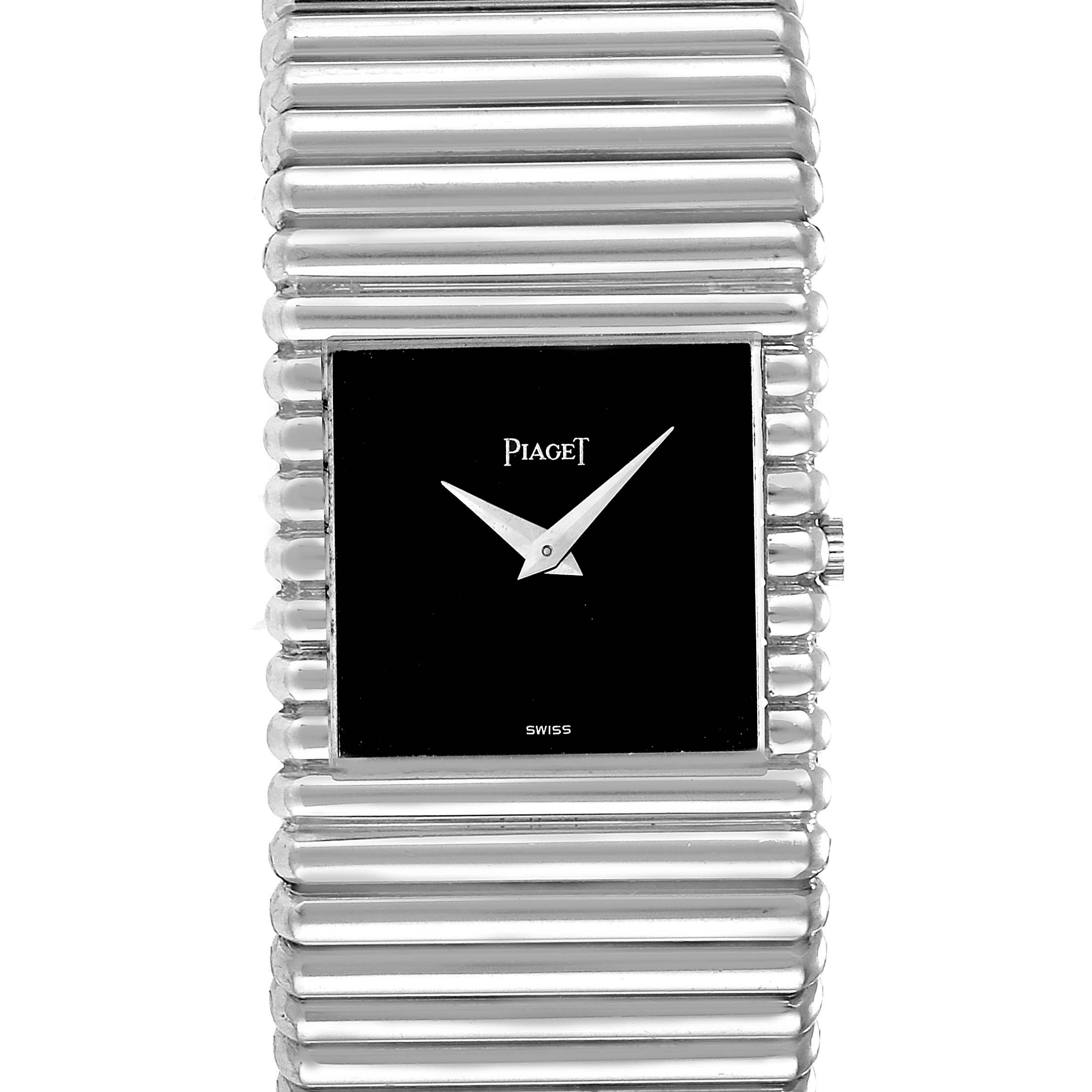The image shows a front view of the Piaget 9131 C 10 Men
s White Gold Black Dial 9131 C 10 Men
s White Gold Black Dial Polo 18K White Gold 9131 model, highlighting its black dial and fluted band.