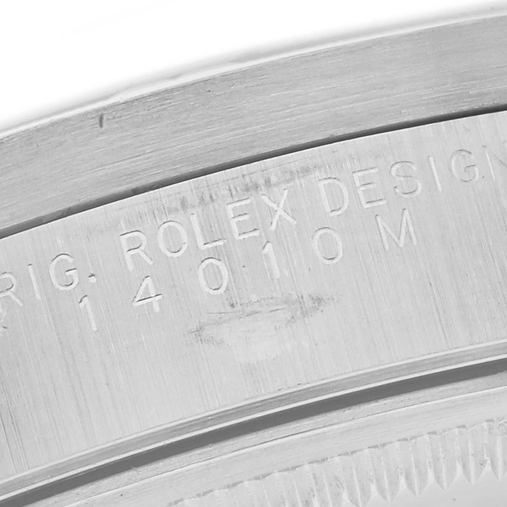 The image shows a close-up of the engraving on the inner bezel ring of a Rolex Air-King 14010 Men's Stainless Steel Black Dial 14010 Men's Stainless Steel Black Dial watch.