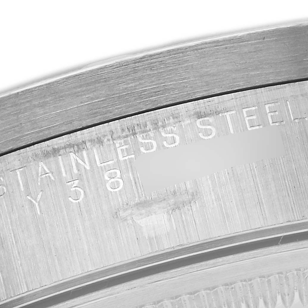 This close-up image shows the side of the watch case back of a Rolex Air-King 14010 Men's Stainless Steel Black Dial 14010 Men's Stainless Steel Black Dial, highlighting the engraved text.