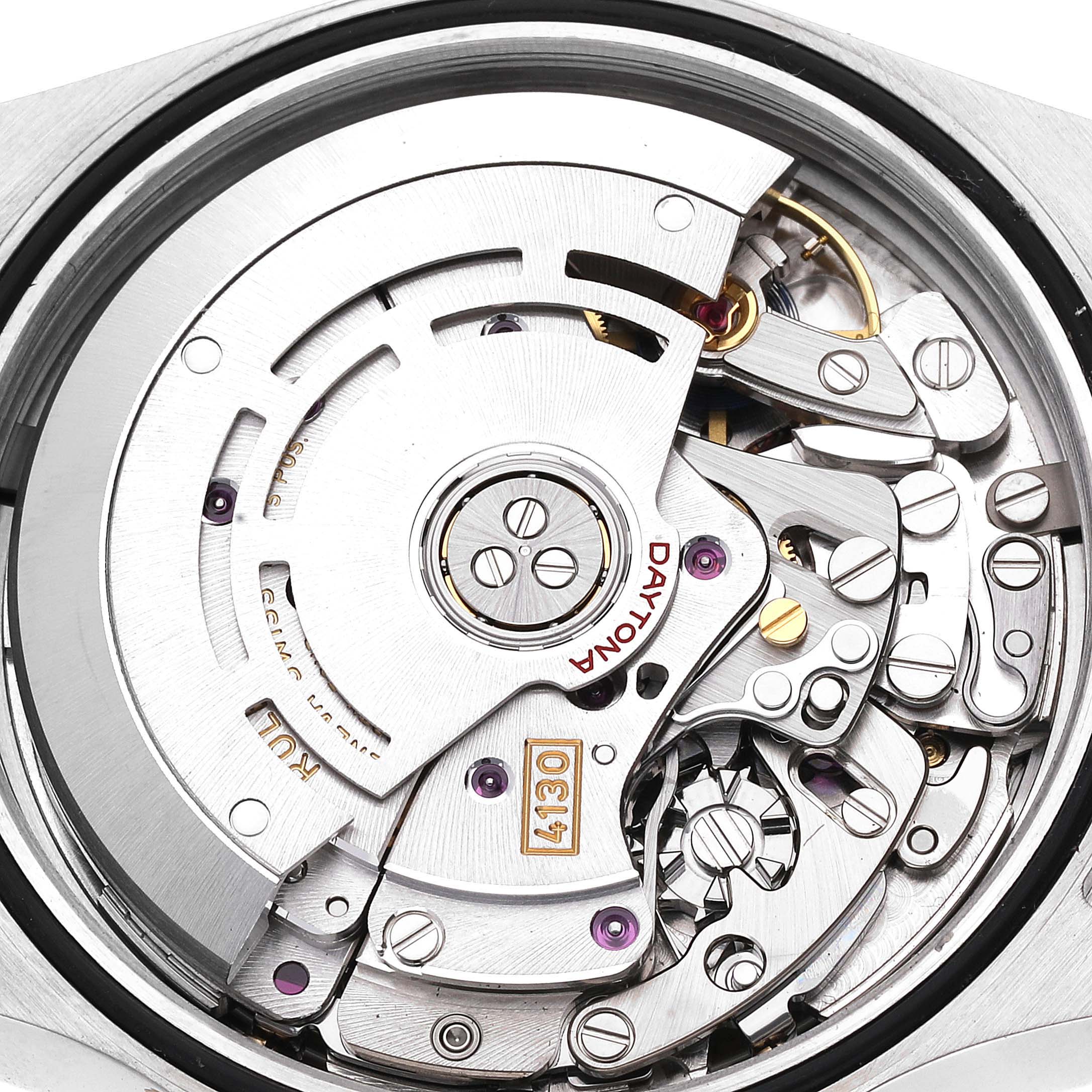 The image shows the intricate movement mechanism of a Rolex Daytona 116503 Men
s Steel and Gold (two tone) White Dial 116503 Men
s Steel and Gold (two tone) White Dial watch from a close-up, top-down angle.
