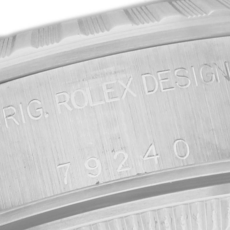 This image shows a close-up of the case back engraving on a Rolex Date 79240 Women's Stainless Steel Black Dial 79240 Women's Stainless Steel Black Dial model watch, highlighting the serial and model numbers.