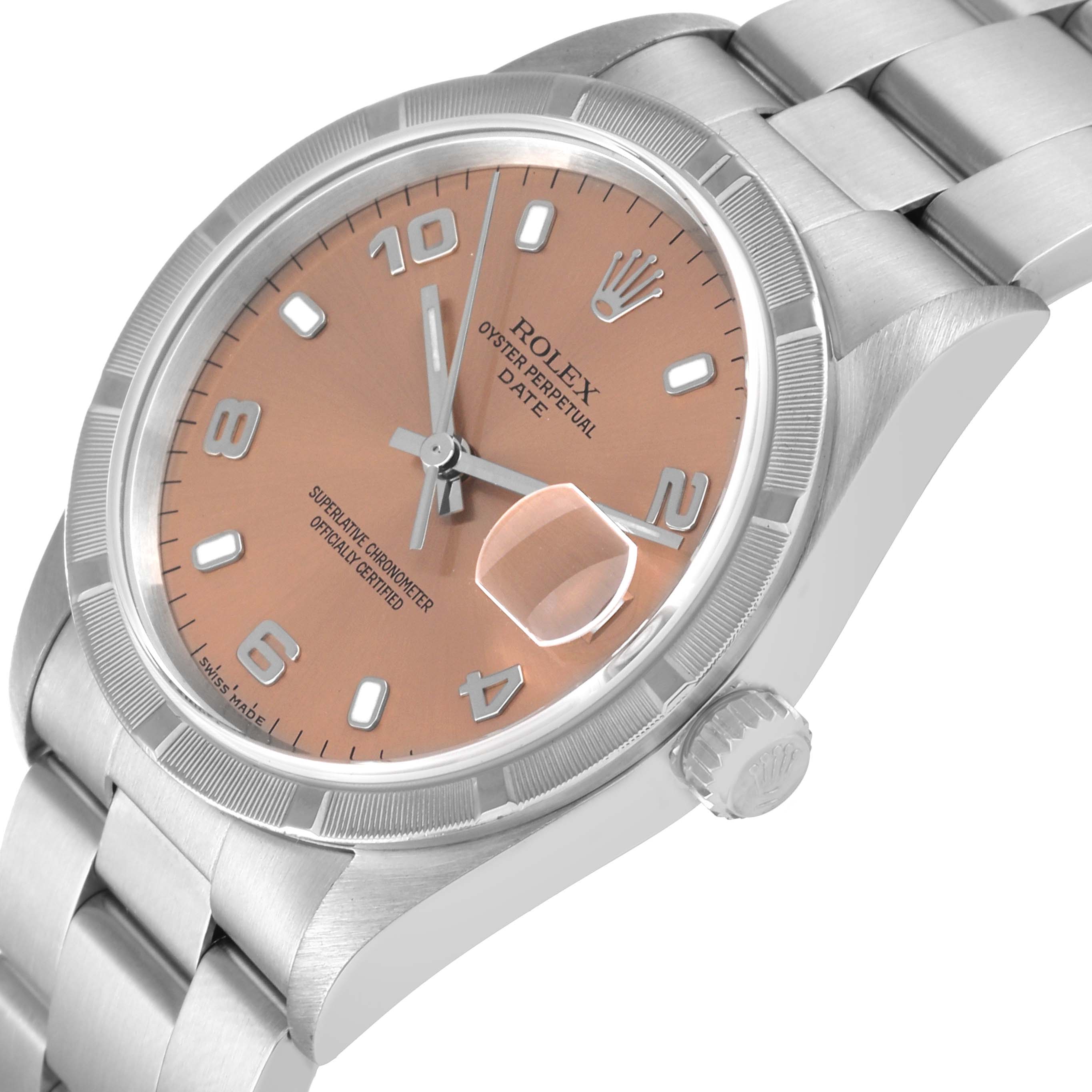 The image shows a Rolex Date 15210 Men
s Stainless Steel Pink Dial 15210 Men
s Stainless Steel Pink Dial model watch at an angled close-up, highlighting the dial, crown, and part of the bracelet.