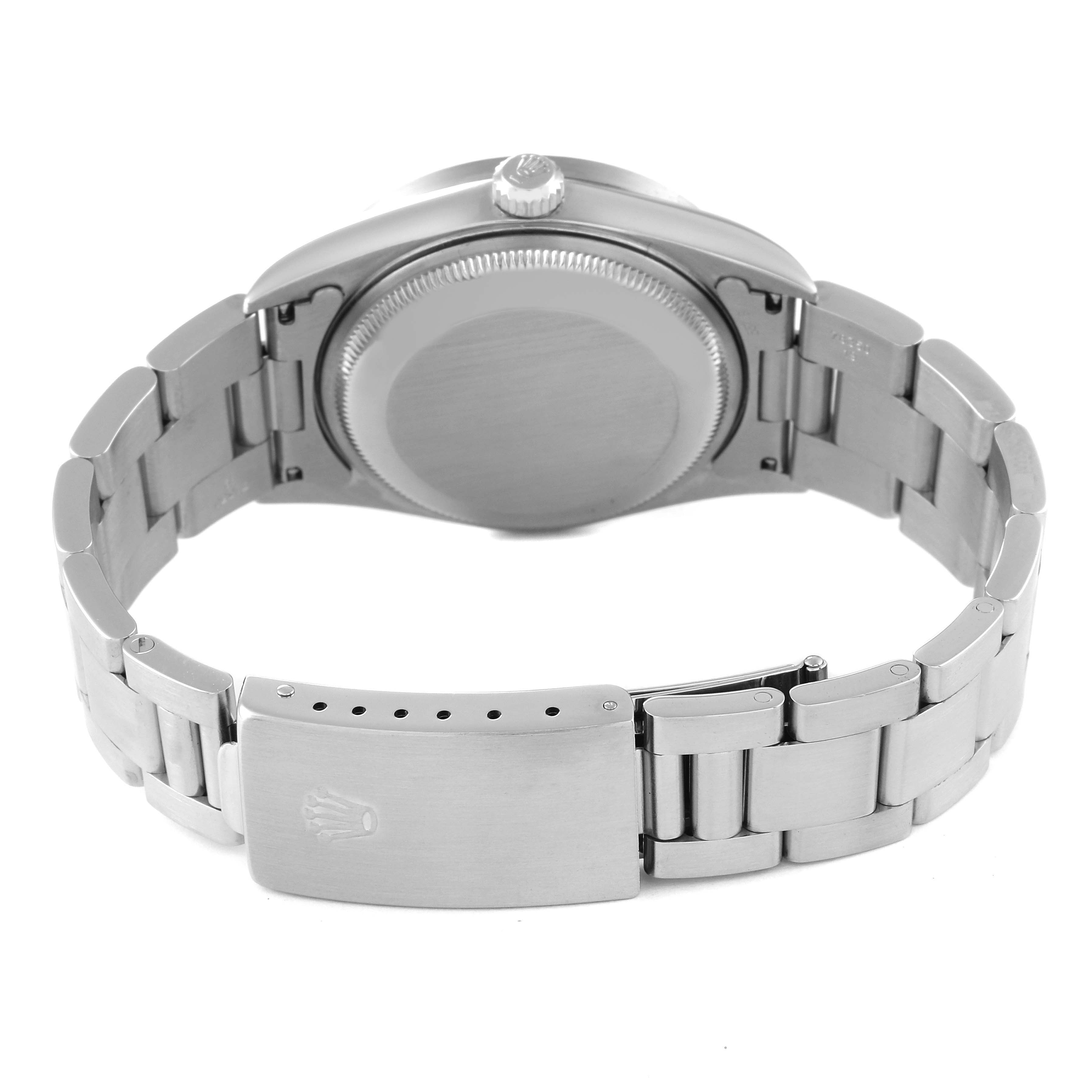 The image shows the back view of a Rolex Date 15210 Men
s Stainless Steel Pink Dial 15210 Men
s Stainless Steel Pink Dial model watch, highlighting the bracelet, clasp, and case back.