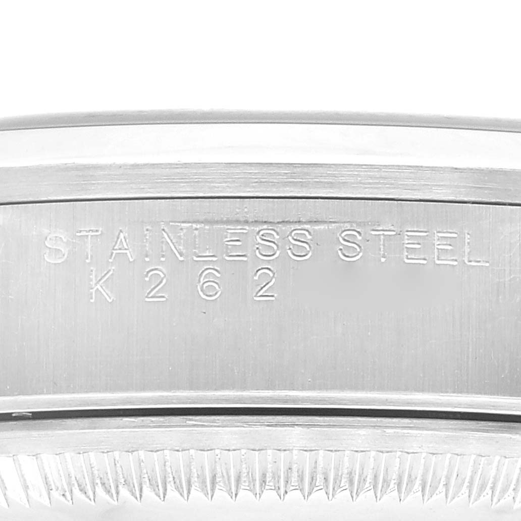 The image shows a close-up of the side engraving on the stainless steel casing of a Rolex Date 15200 Men's Stainless Steel Pink Dial 15200 Men's Stainless Steel Pink Dial model watch.