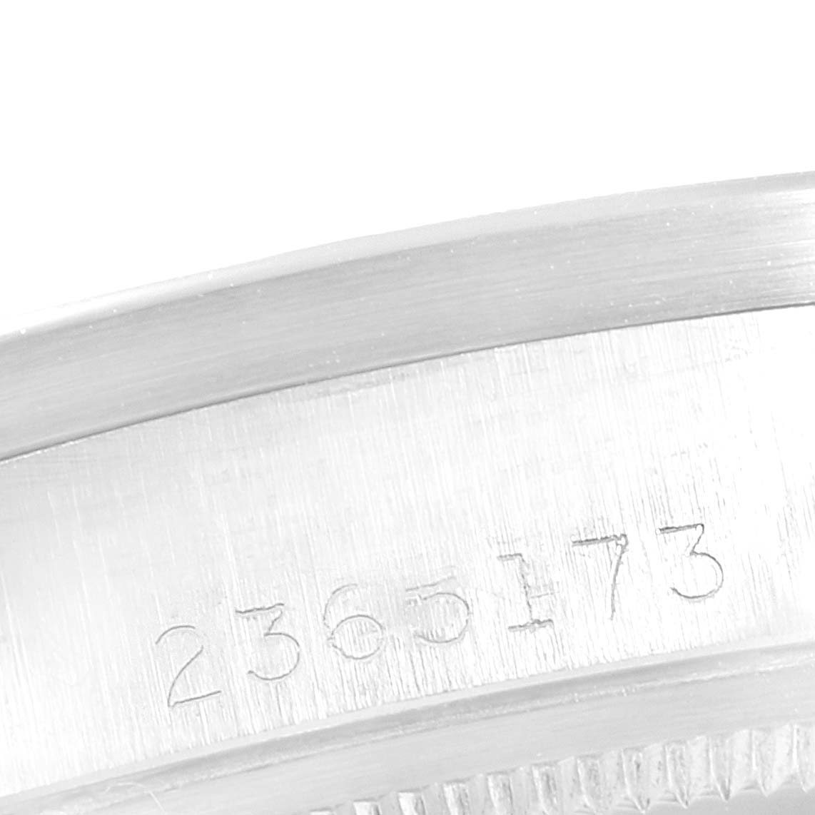 This image shows the engraved serial number on a Rolex Vintage Collection 1501 Men
s Stainless Steel Silver Dial 1501 Men
s Stainless Steel Silver Dial watch case.