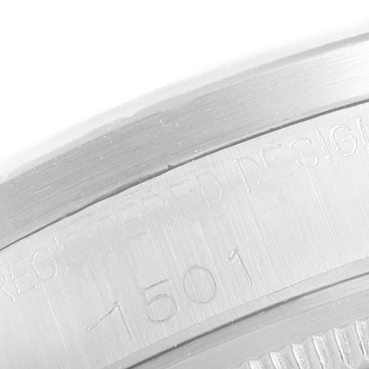 The image shows an engraved serial number on the casing of a Rolex Vintage Collection 1501 Men
s Stainless Steel Silver Dial 1501 Men
s Stainless Steel Silver Dial model, viewed in close-up.
