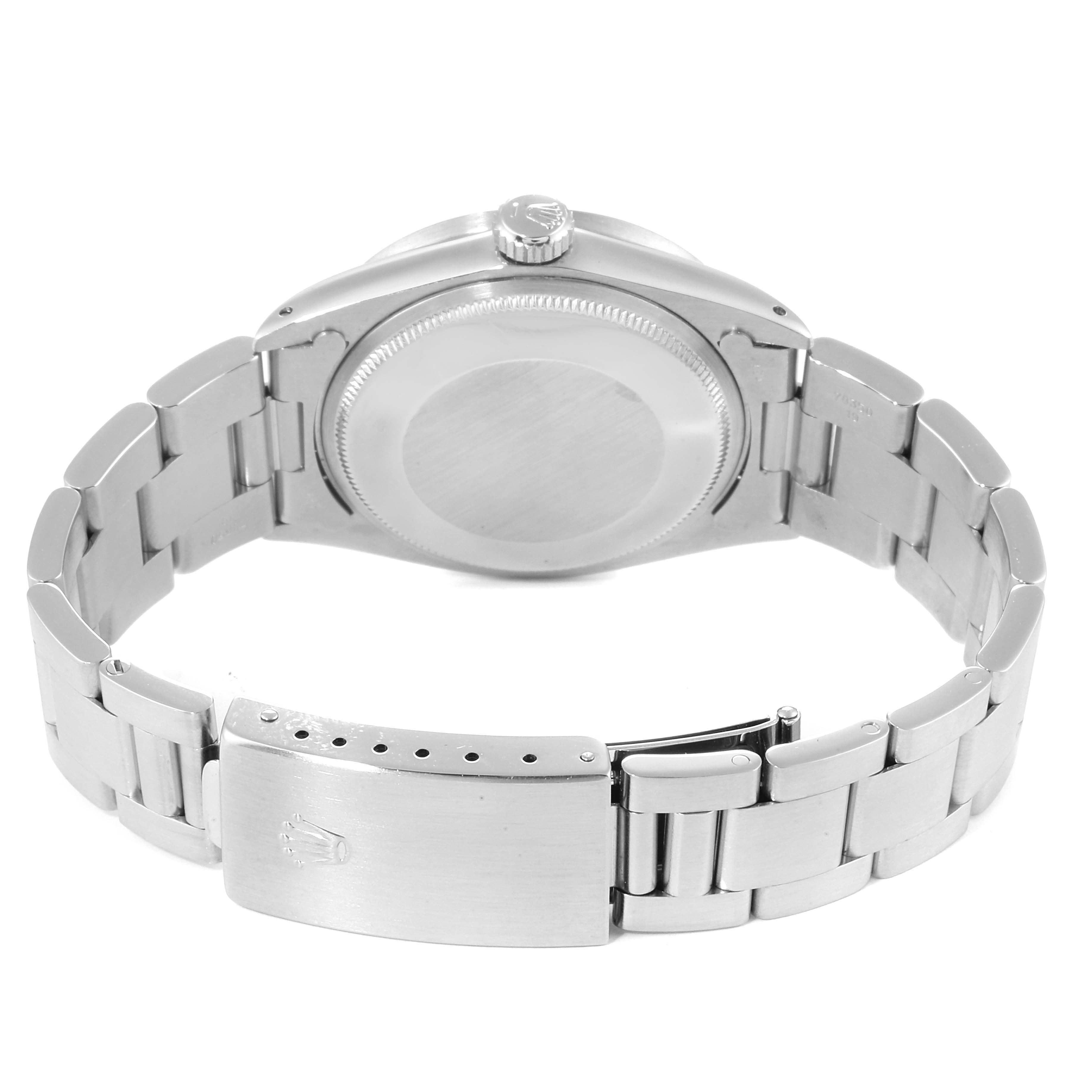 The image shows the back view of a Vintage Collection Rolex, highlighting the case back and the stainless steel bracelet with its clasp.