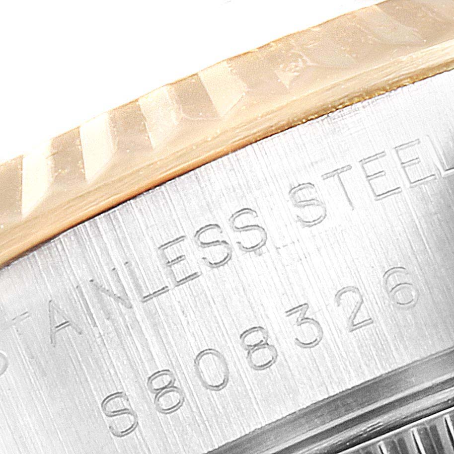 This close-up angle shows the stainless steel case and engraved serial number of the Rolex Datejust 69173 Women's Stainless Steel Champagne Dial 69173 Women's Stainless Steel Champagne Dial watch.