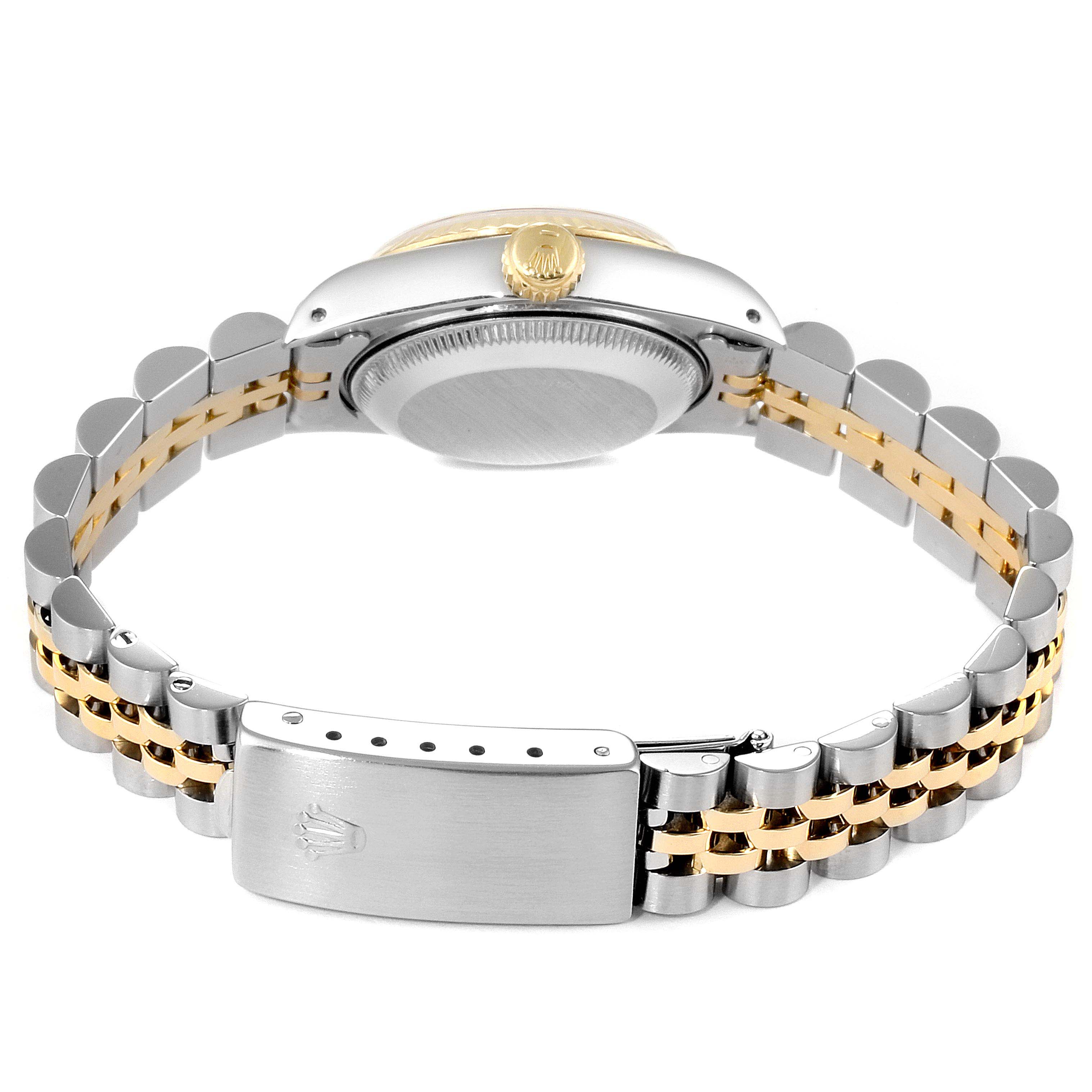 The image shows the back of a Rolex Datejust 69173 Women
s Steel and Gold (two tone) Champagne Dial 69173 Women
s Steel and Gold (two tone) Champagne Dial watch, highlighting the case back, crown, and two-tone bracelet with clasp.