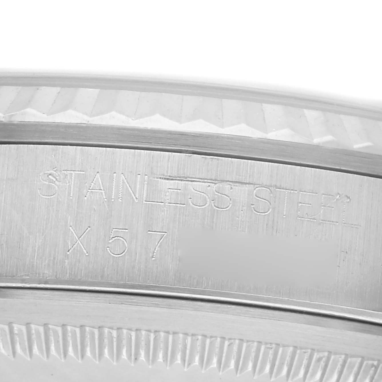 The image shows a close-up of the engraved stainless steel case back of a Rolex Datejust 16234 Men's Stainless Steel White Dial 16234 Men's Stainless Steel White Dial watch.