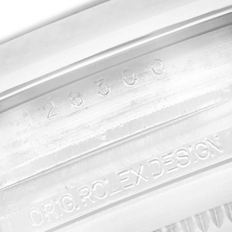 The image shows an angled close-up of the inner bezel inscriptions of a Rolex Datejust 41 126300 Men's Stainless Steel Black Dial 126300 Men's Stainless Steel Black Dial, detailing the model and "Orig Rolex Design."