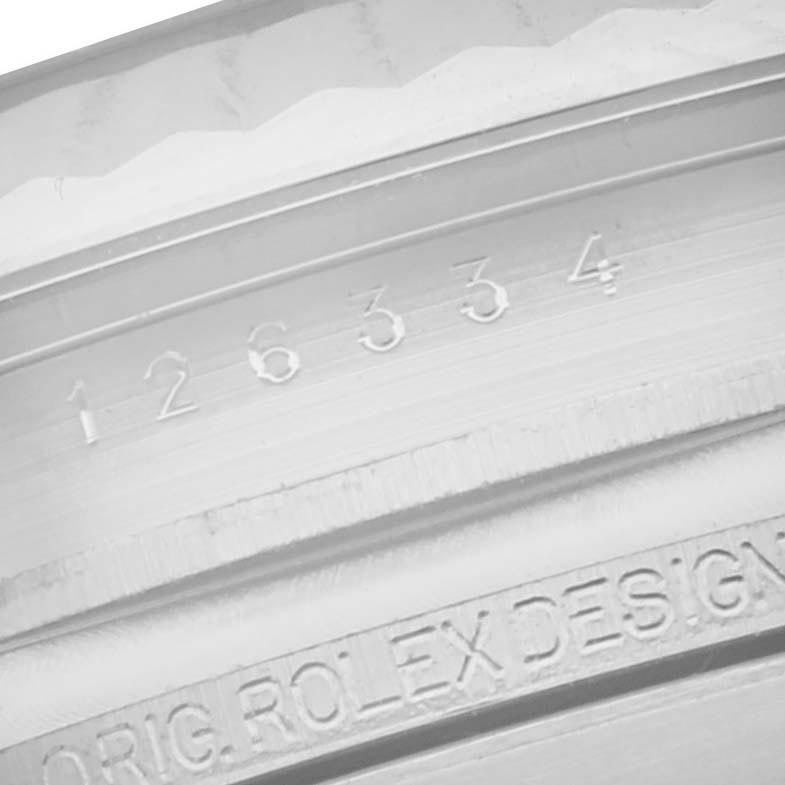 The image shows a close-up of the inner bezel of a Rolex Datejust 41 126334 Men's Stainless Steel Grey Dial 126334 Men's Stainless Steel Grey Dial, displaying the model number and “ORIG. ROLEX DESIGN” engraving.