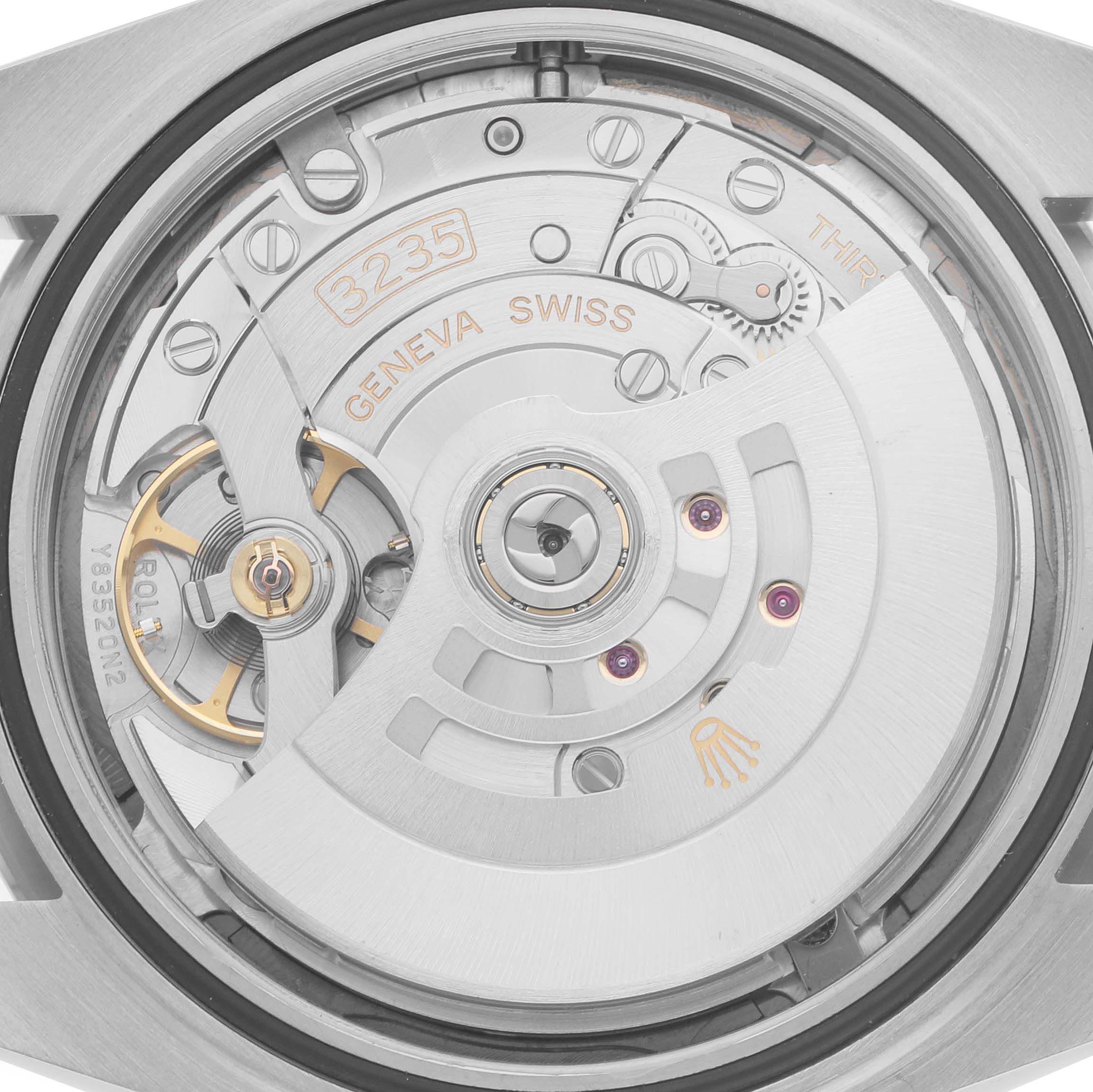 The image shows the back view of the Rolex Datejust 41 126334 Men's Stainless Steel Grey Dial 126334 Men's Stainless Steel Grey Dial, focusing on the intricate movement and rotor mechanisms.