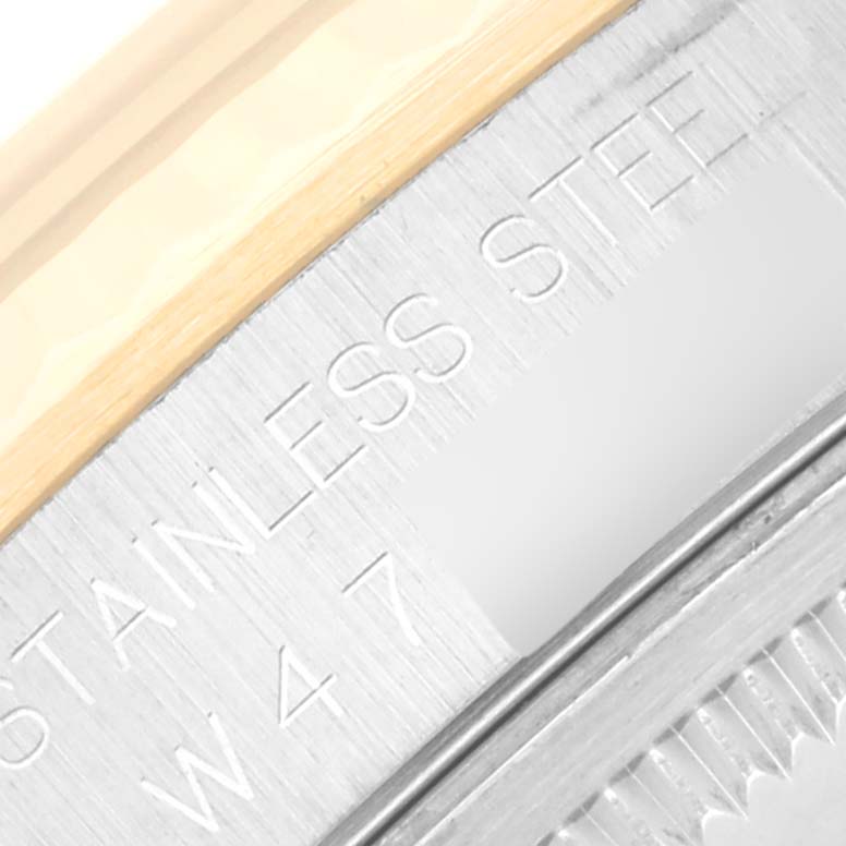 This image shows a close-up of the edge and engravings on the stainless steel case of a Rolex Datejust 16233 Men's Steel and Gold (two tone) Blue Dial 16233 Men's Steel and Gold (two tone) Blue Dial watch.