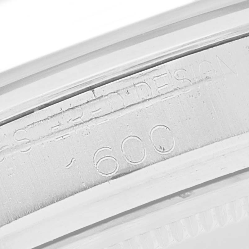 This image shows a macro shot of the side engraving on a Rolex Vintage Collection 1600 Men's Stainless Steel Grey Dial 1600 Men's Stainless Steel Grey Dial watch case.