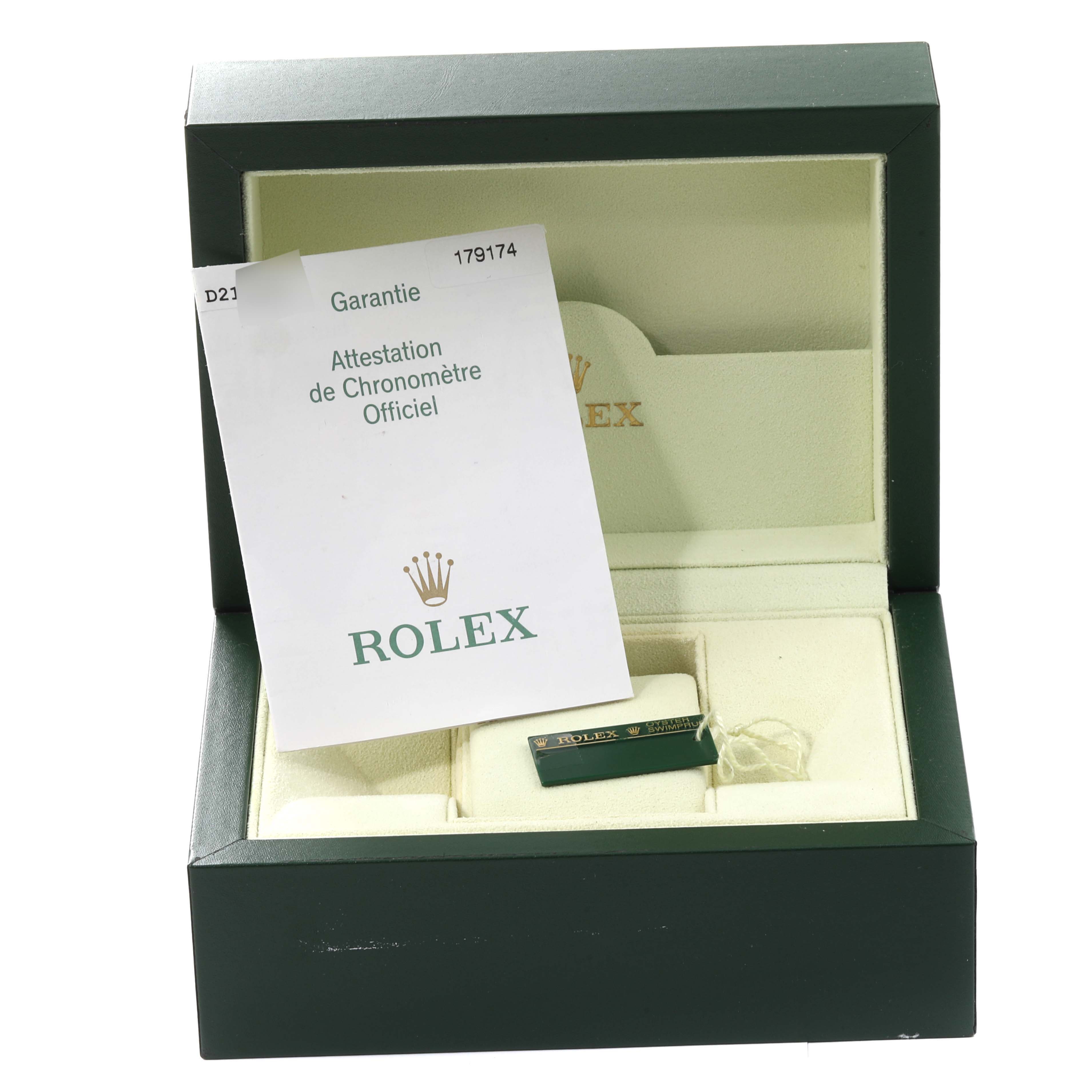 The image shows an open green box for the Rolex Datejust 179174 Women's Stainless Steel Blue Dial 179174 Women's Stainless Steel Blue Dial model with a certificate and tags inside.