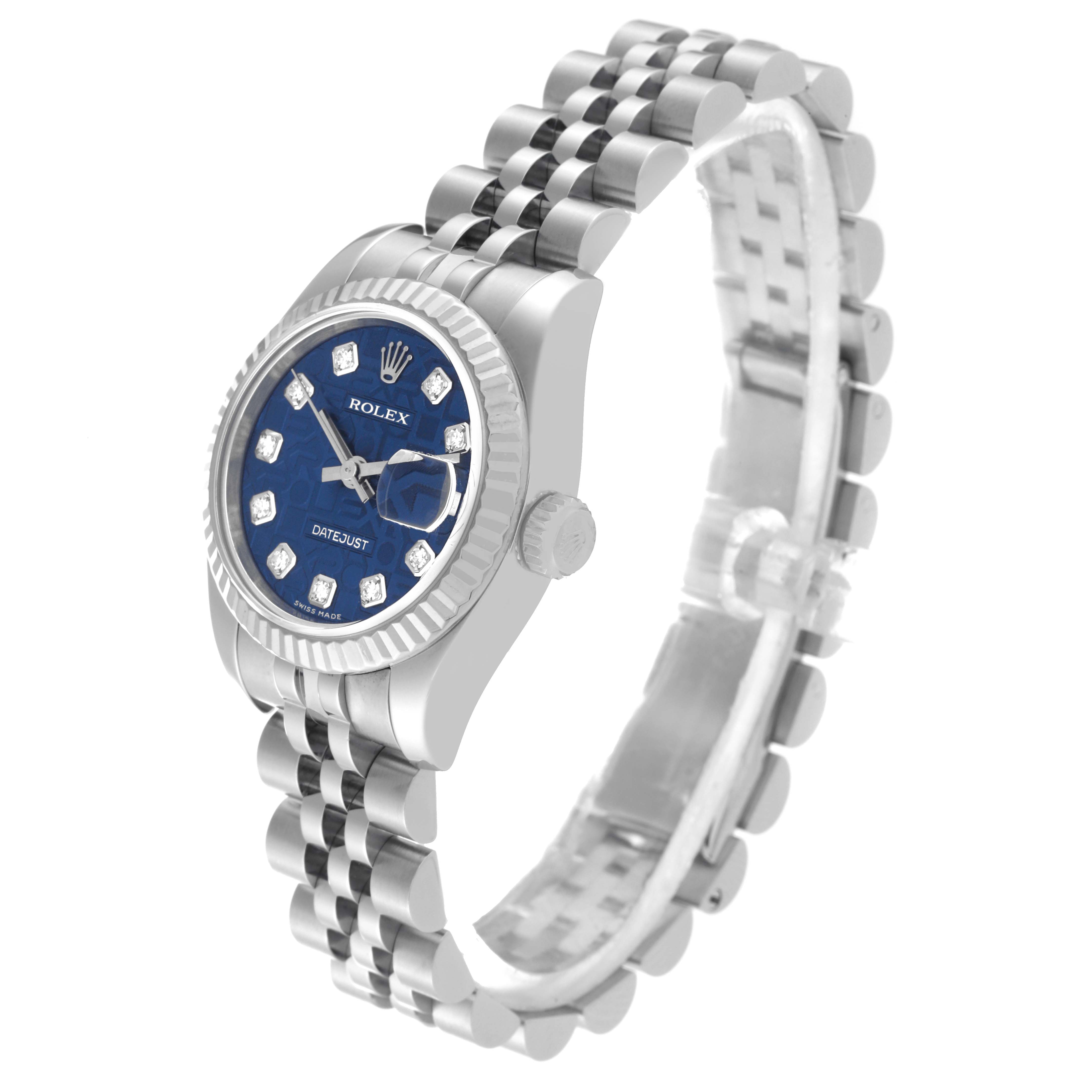 This image shows a side angle of a Rolex Datejust 179174 Women's Stainless Steel Blue Dial 179174 Women's Stainless Steel Blue Dial watch, highlighting its blue dial, fluted bezel, and Jubilee bracelet.