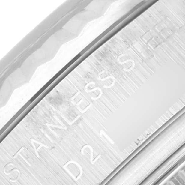 This close-up shows the side view of the bezel and part of the stainless steel case of a Rolex Datejust 179174 Women's Stainless Steel Blue Dial 179174 Women's Stainless Steel Blue Dial watch.