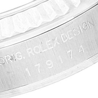 This image shows a close-up of the Rolex Datejust 179174 Women
s Stainless Steel Mother of Pearl Dial 179174 Women
s Stainless Steel Mother of Pearl Dial model
s inner bezel with engraved details.