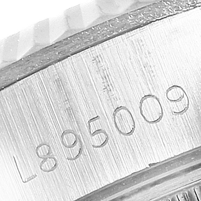 This close-up image shows the serial number engraved on the side of a Rolex Datejust 69174 Women's Stainless Steel Silver Dial 69174 Women's Stainless Steel Silver Dial watch.