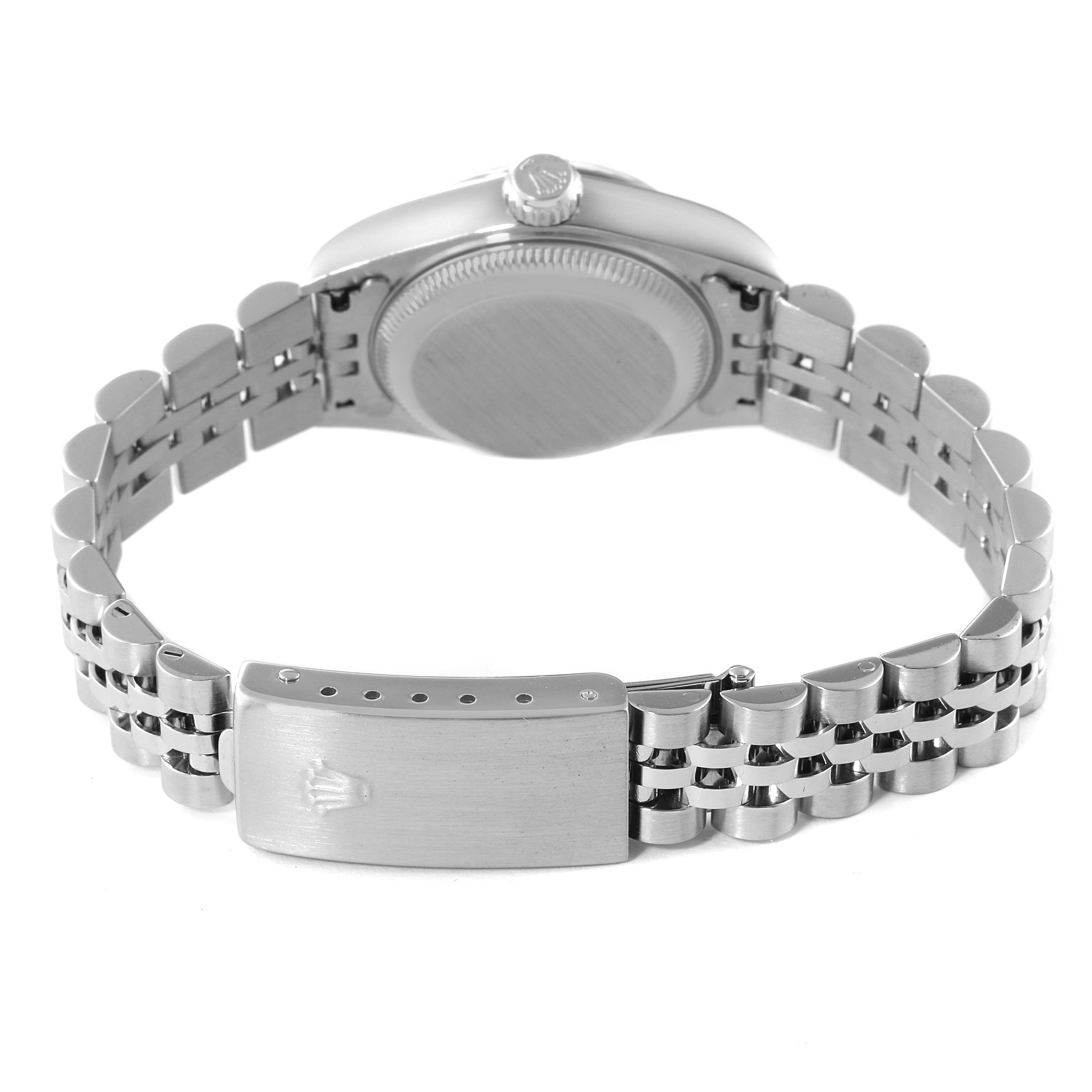 The image shows the back view of a Rolex Datejust 79174 Women's Stainless Steel White Dial 79174 Women's Stainless Steel White Dial watch, highlighting its case back and metal bracelet with a clasp.