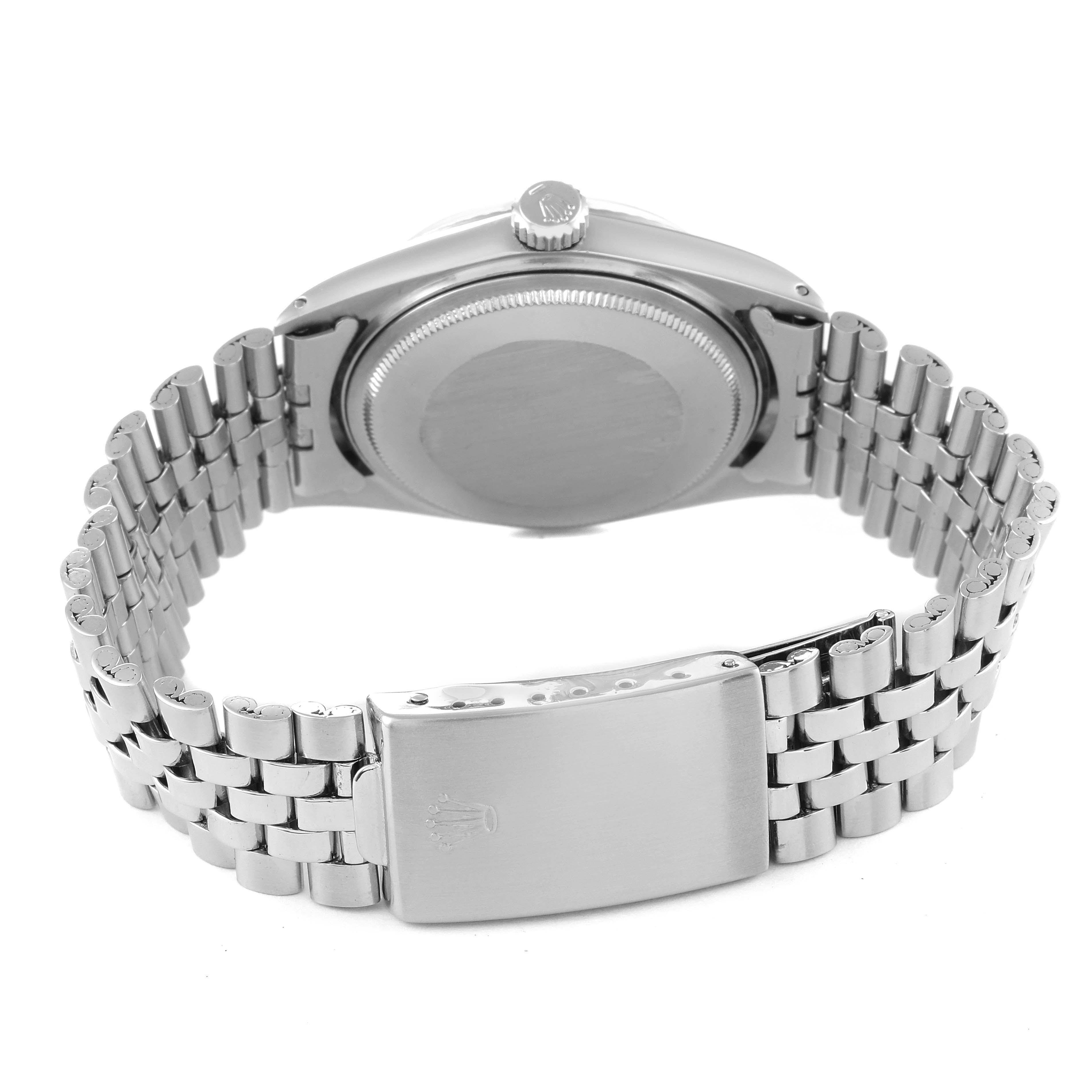 The image shows the back case and bracelet of a Vintage Collection Rolex watch from a rear angle.