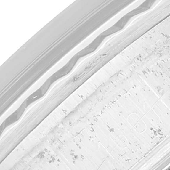 The image shows a close-up of the bezel and part of the case of the Vintage Collection model by Rolex.