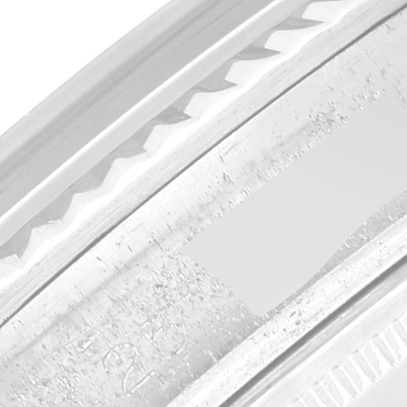 This close-up image shows a detailed section of the bezel from a Rolex Vintage Collection 1601 Men's Stainless Steel Grey Dial 1601 Men's Stainless Steel Grey Dial model watch.