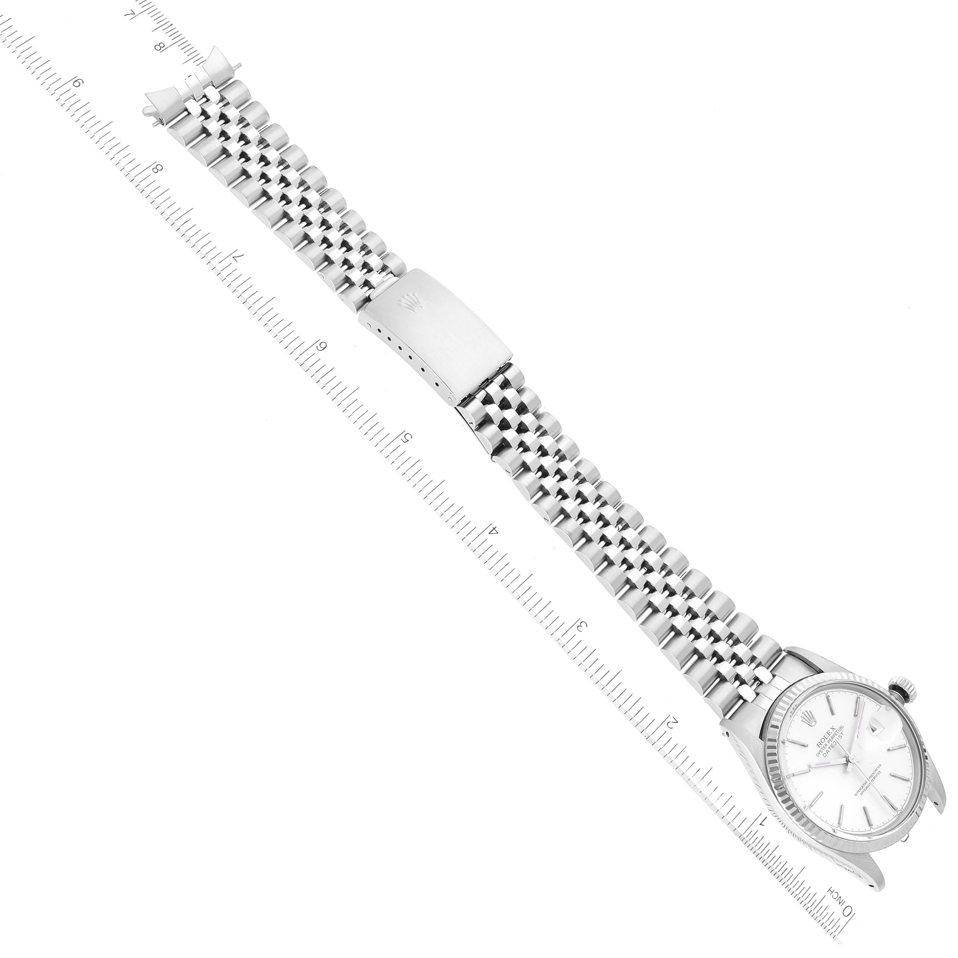 The image shows a top-down view of the Rolex Vintage Collection 16014 Men's Stainless Steel Silver Dial 16014 Men's Stainless Steel Silver Dial watch highlighting the clasp, band, and face.