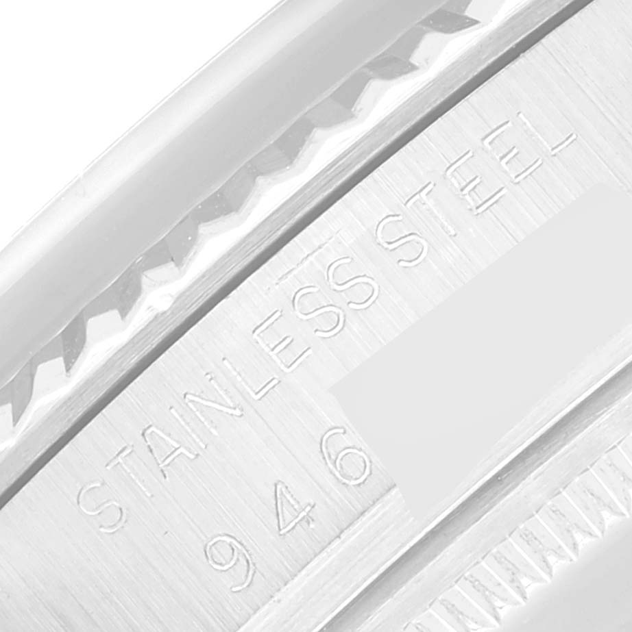 This close-up image of the Rolex Vintage Collection 16014 Men's Stainless Steel Silver Dial 16014 Men's Stainless Steel Silver Dial watch shows the "STAINLESS STEEL" marking on the outer casing.