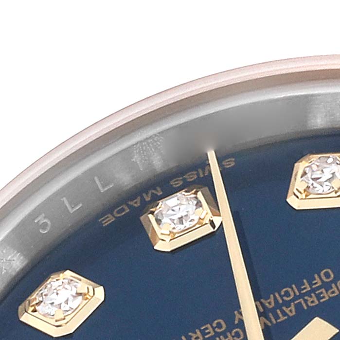 This close-up image shows the dial of a Rolex Datejust 179173 Women's Steel and Gold (two tone) Blue Dial 179173 Women's Steel and Gold (two tone) Blue Dial, featuring diamond hour markers and part of the minute hand.