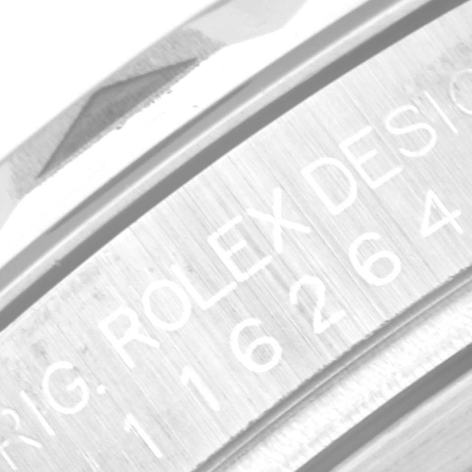 The image shows a close-up of the engraved side of the bezel on a Rolex Turn-o-Graph 116264 Men's Stainless Steel Blue Dial 116264 Men's Stainless Steel Blue Dial watch.