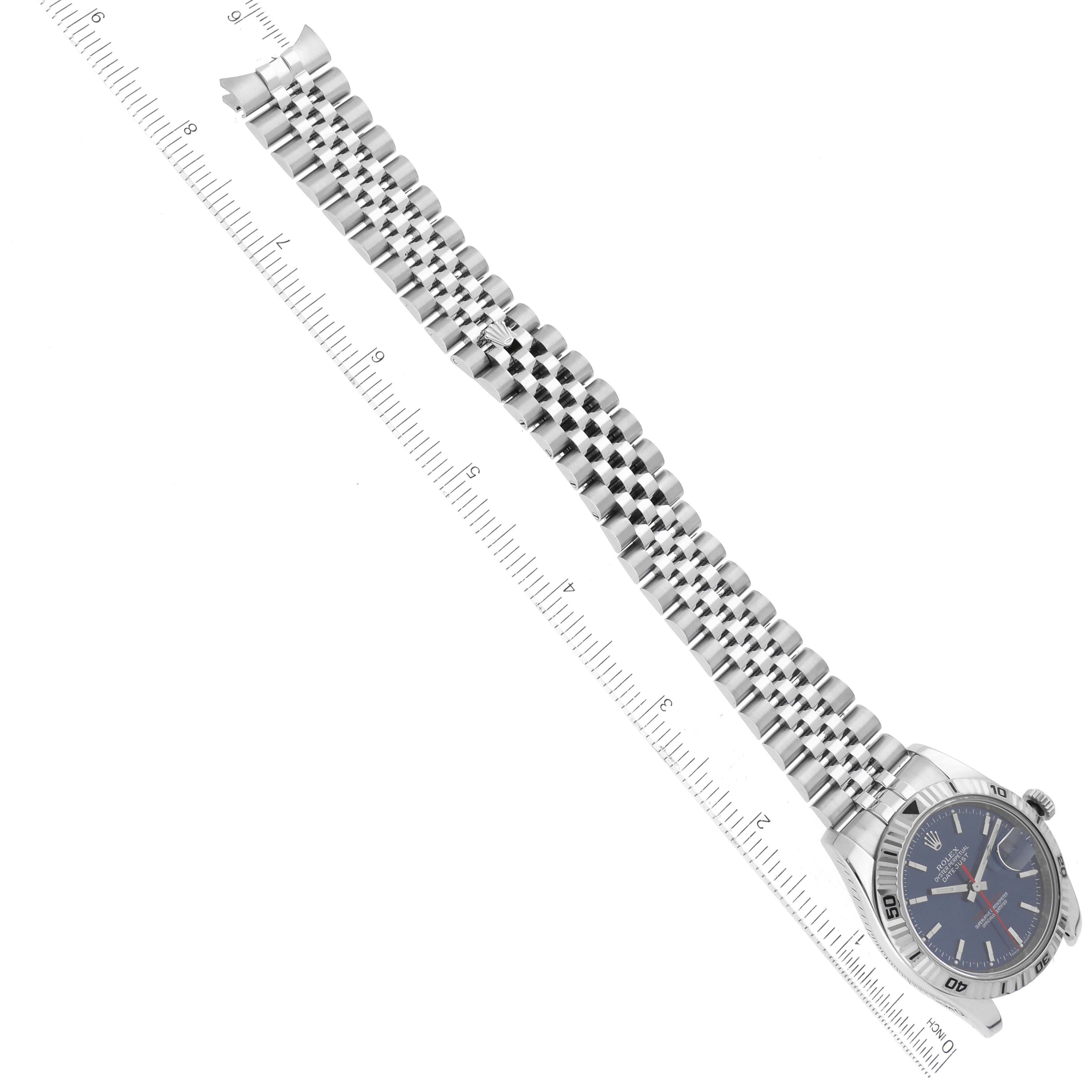 The image shows the full view of a Rolex Turn-o-Graph 116264 Men's Stainless Steel Blue Dial 116264 Men's Stainless Steel Blue Dial watch, including the face, bezel, and metal bracelet, aligned next to a ruler.