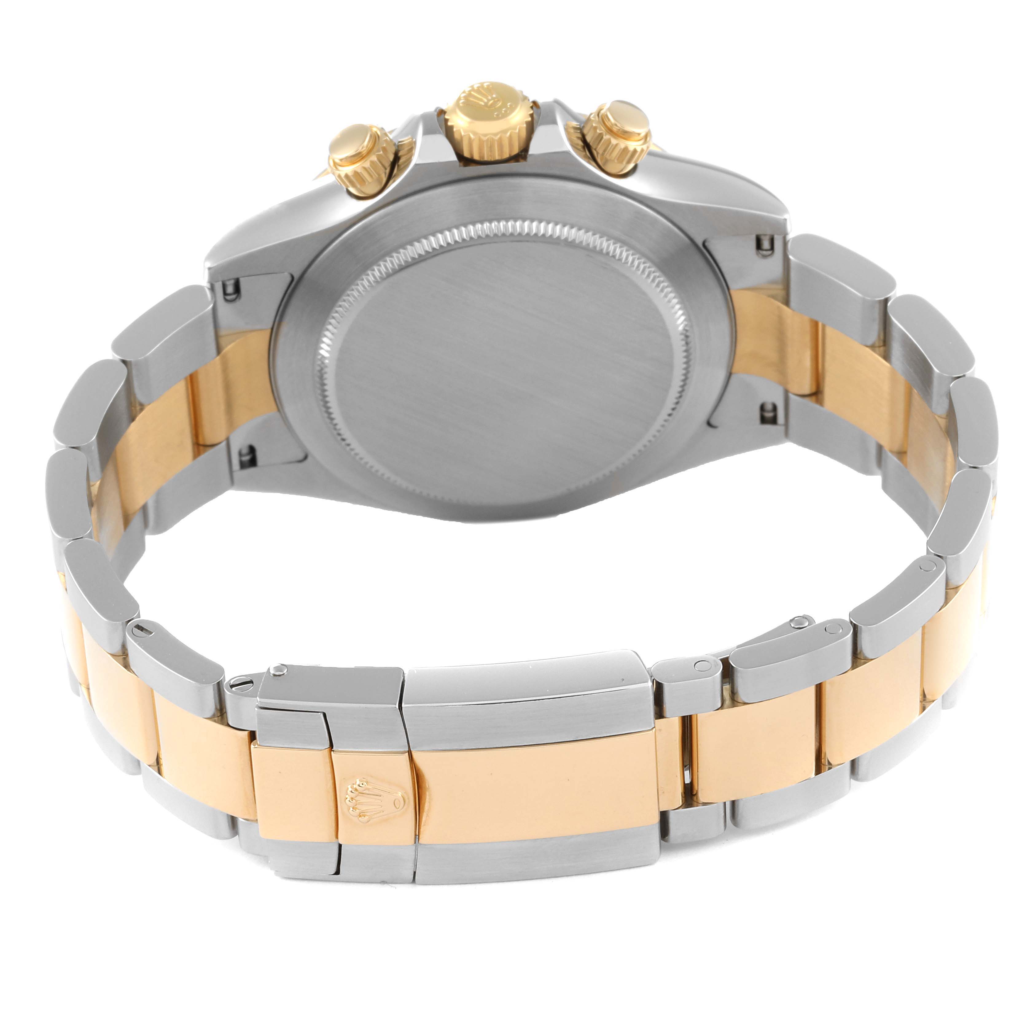 This image shows the back view of the Rolex Daytona 116523 Men
s Steel and Gold (two tone) White Dial 116523 Men
s Steel and Gold (two tone) White Dial watch, highlighting the clasp, bracelet, and crown/pushers.