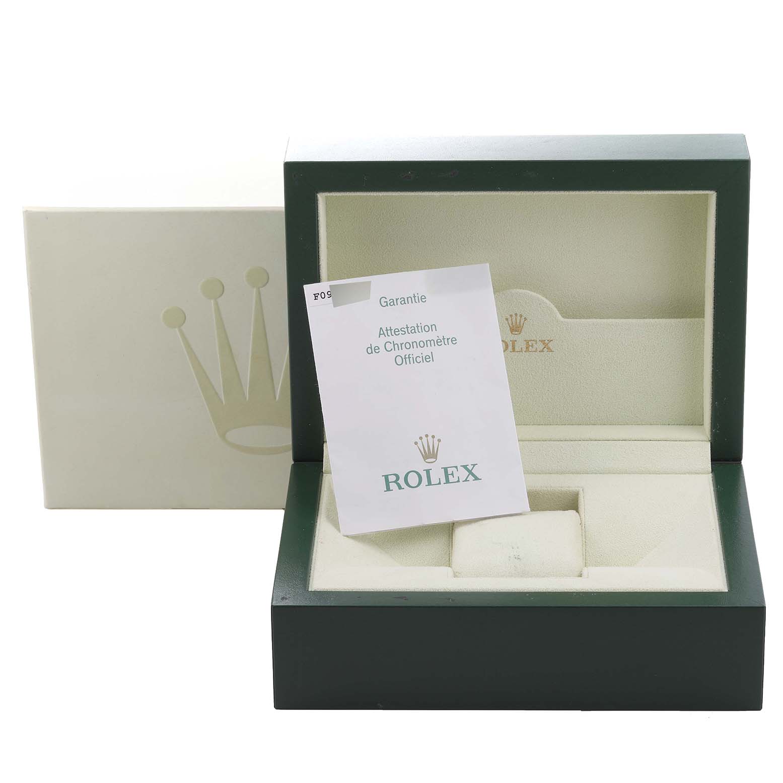 This image shows the open box and guarantee card of a Rolex Daytona 116523 Men
s Steel and Gold (two tone) White Dial 116523 Men
s Steel and Gold (two tone) White Dial watch, viewed from the front.
