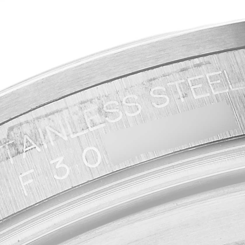 This close-up image shows the "Stainless Steel" inscription on the casing of a Rolex Explorer 16570 Men's Stainless Steel Black Dial 16570 Men's Stainless Steel Black Dial watch.