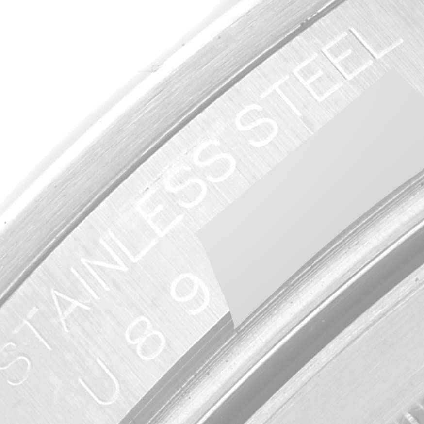 This is a close-up view of the back case of a Rolex Explorer 16570 Men
s Stainless Steel Black Dial 16570 Men
s Stainless Steel Black Dial model, showing the "STAINLESS STEEL" engraving.