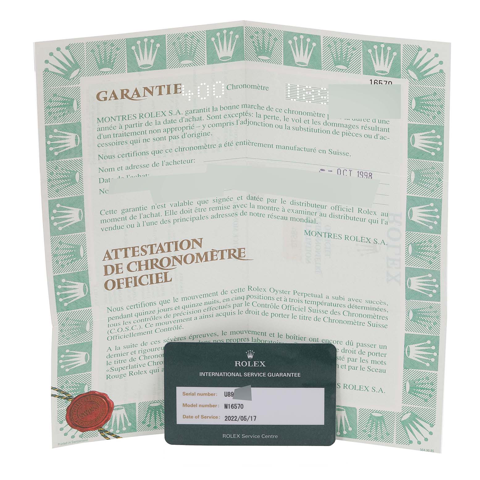 The image shows the warranty paperwork and an international service guarantee card for a Rolex Explorer 16570 Men
s Stainless Steel Black Dial 16570 Men
s Stainless Steel Black Dial model watch.