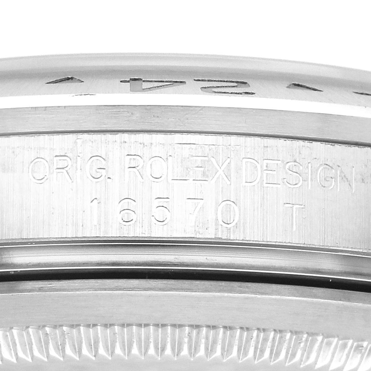 The image shows a close-up side view of the case and bezel of a Rolex Explorer 16570 Men's Stainless Steel Black Dial 16570 Men's Stainless Steel Black Dial model, highlighting the engraved text.