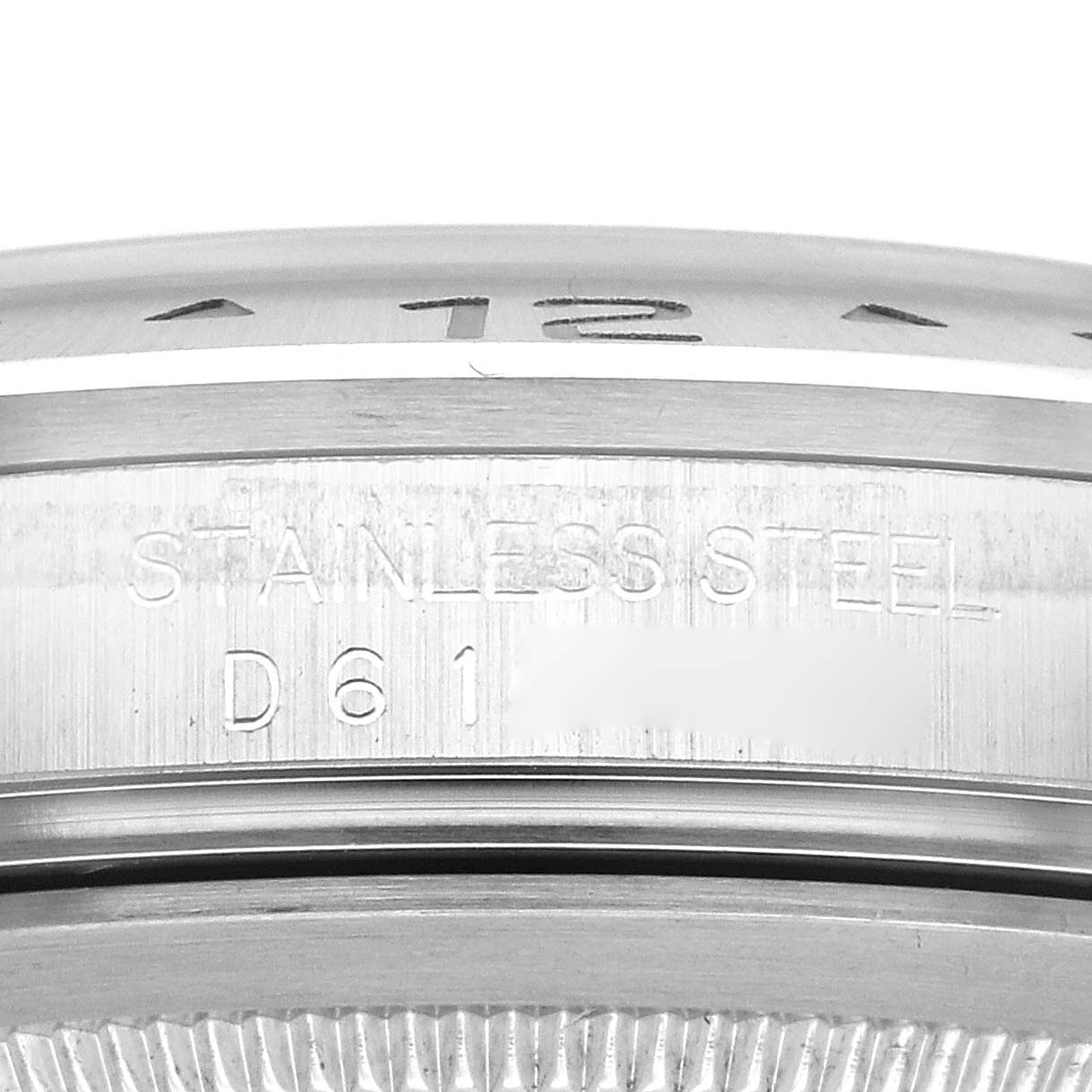 This image shows a close-up of the engraved inner bezel and case of a Rolex Explorer 16570 Men's Stainless Steel Black Dial 16570 Men's Stainless Steel Black Dial watch in stainless steel.